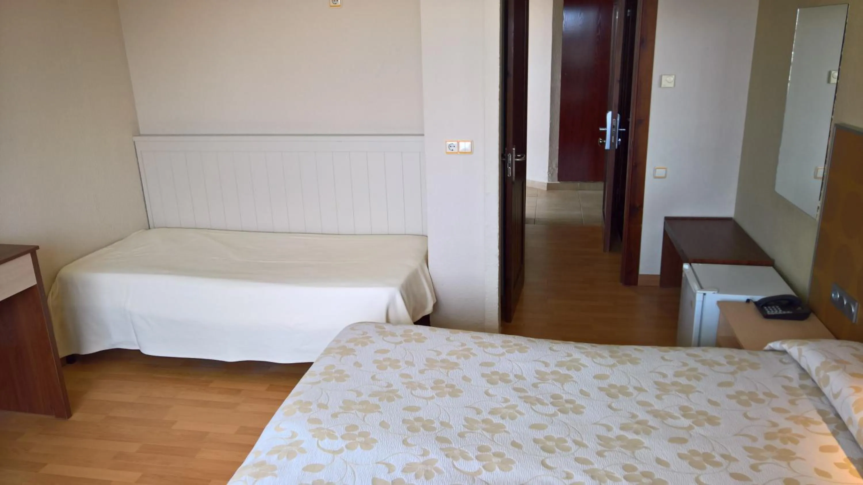 Bed in Hotel Flamero