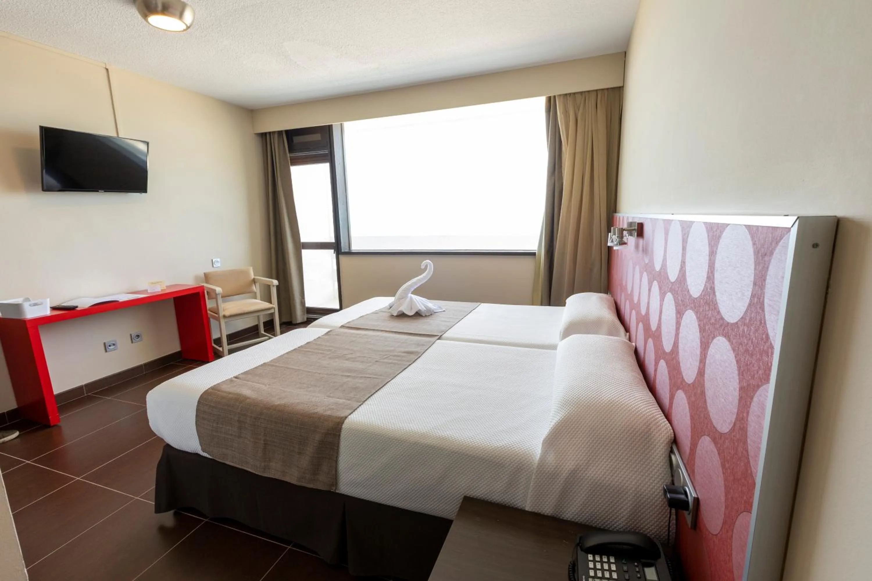 Bed in Hotel Flamero