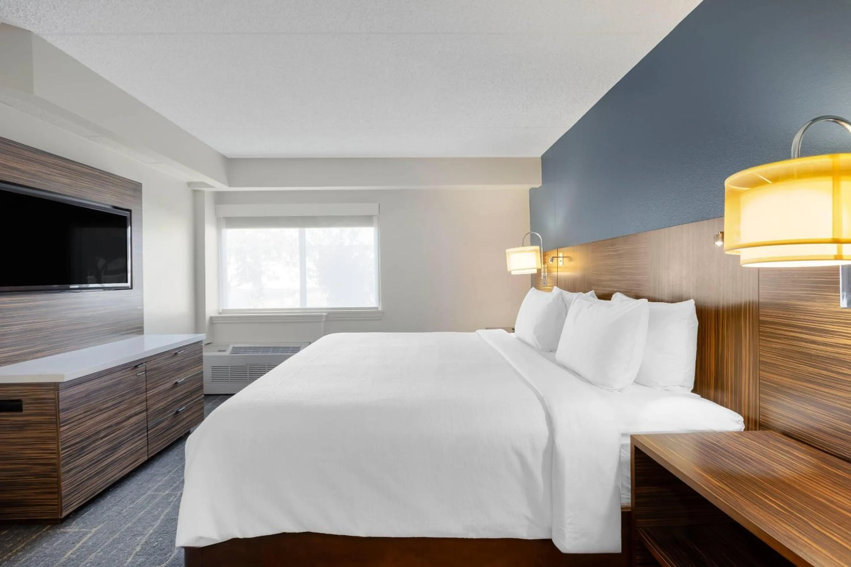 Bedroom, Bed in The Lux Hotel & Conference Center, an Ascend Collection Hotel