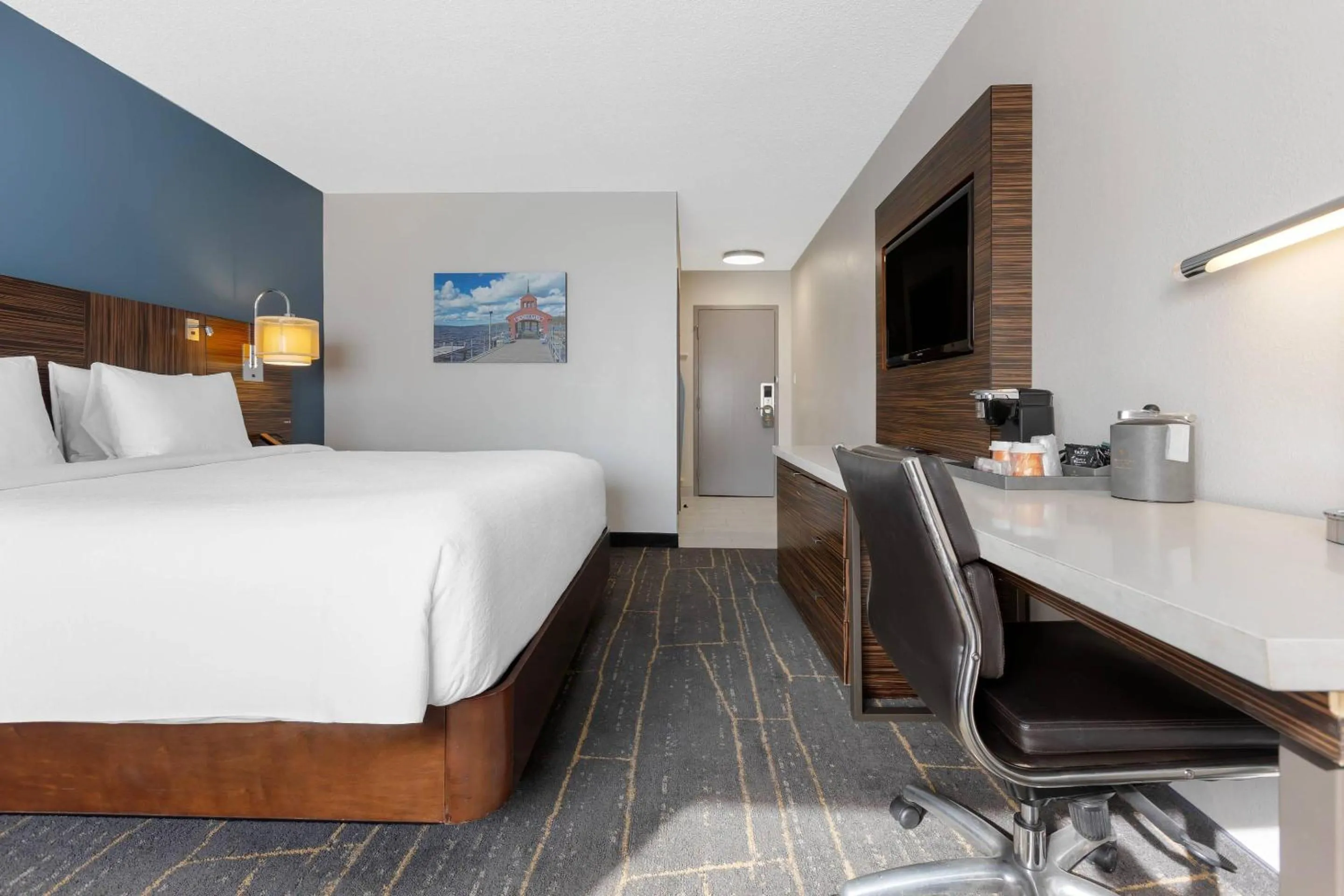 Bedroom, Bed in The Lux Hotel & Conference Center, an Ascend Collection Hotel