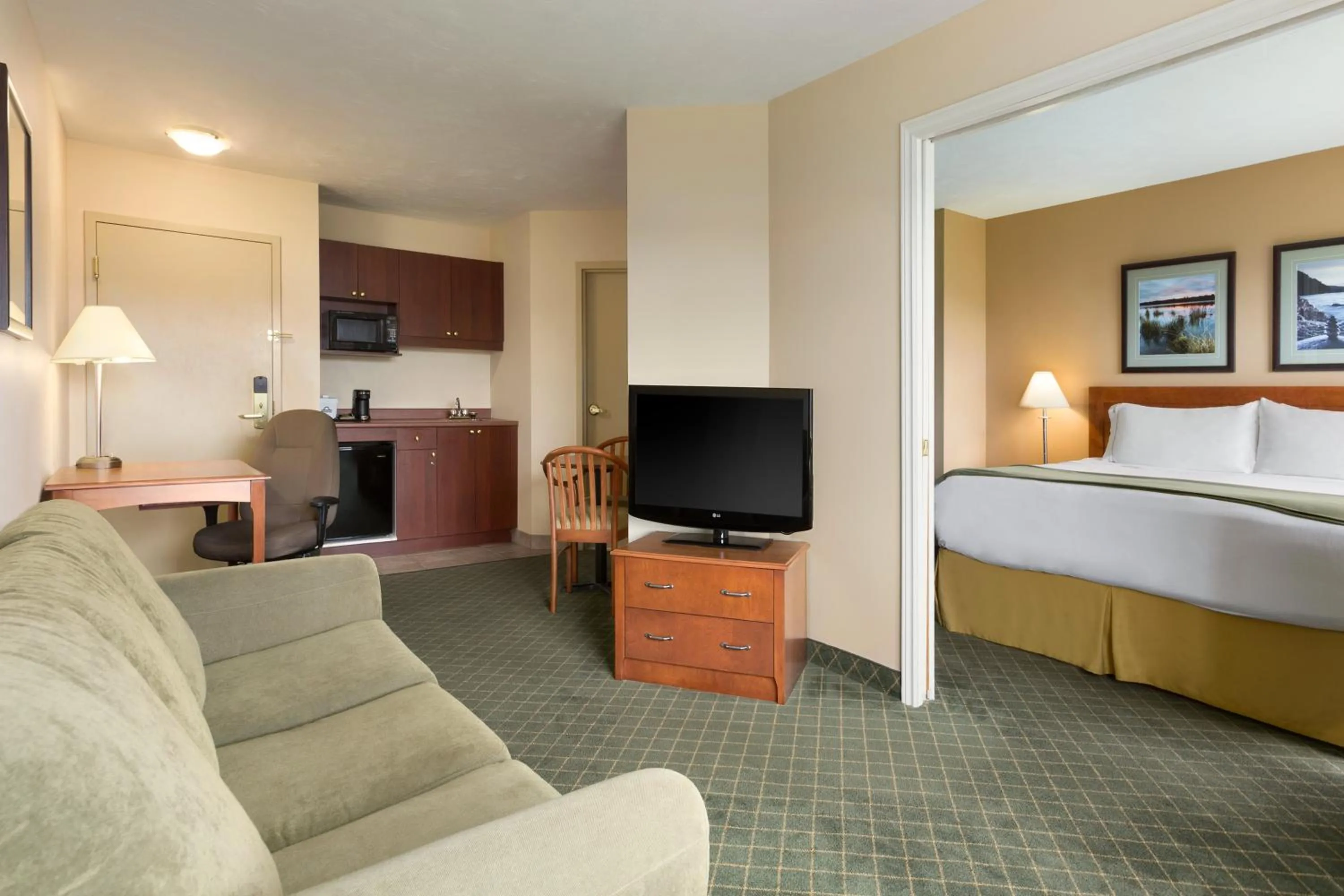 Living room, Bed in Days Inn & Suites by Wyndham Moncton