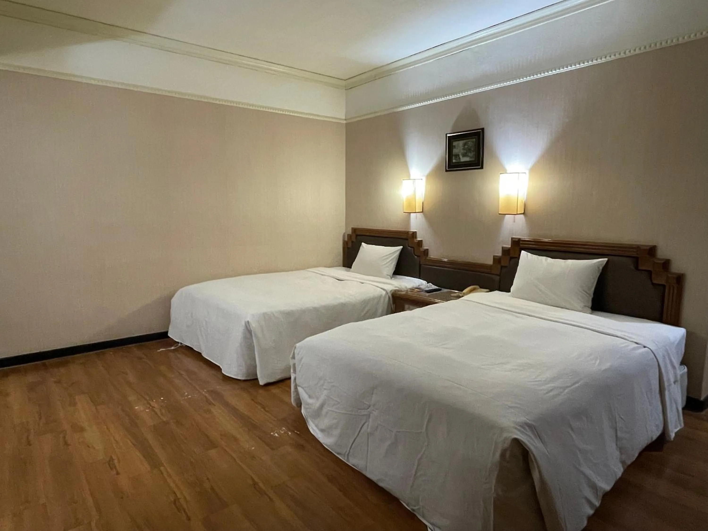 Bed in Tapeng Bay Holiday Hotel