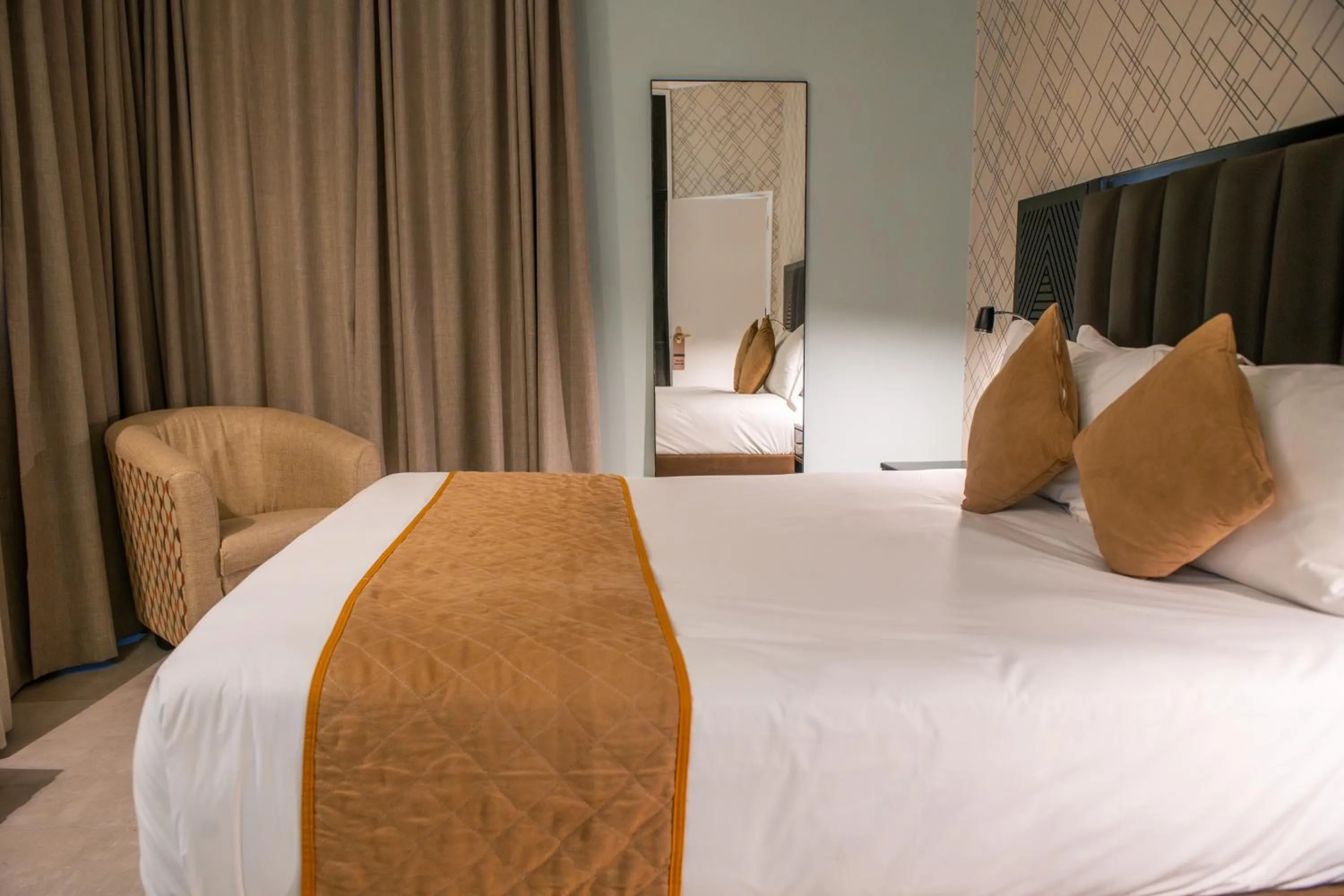 Bed in New Ambassador Hotel