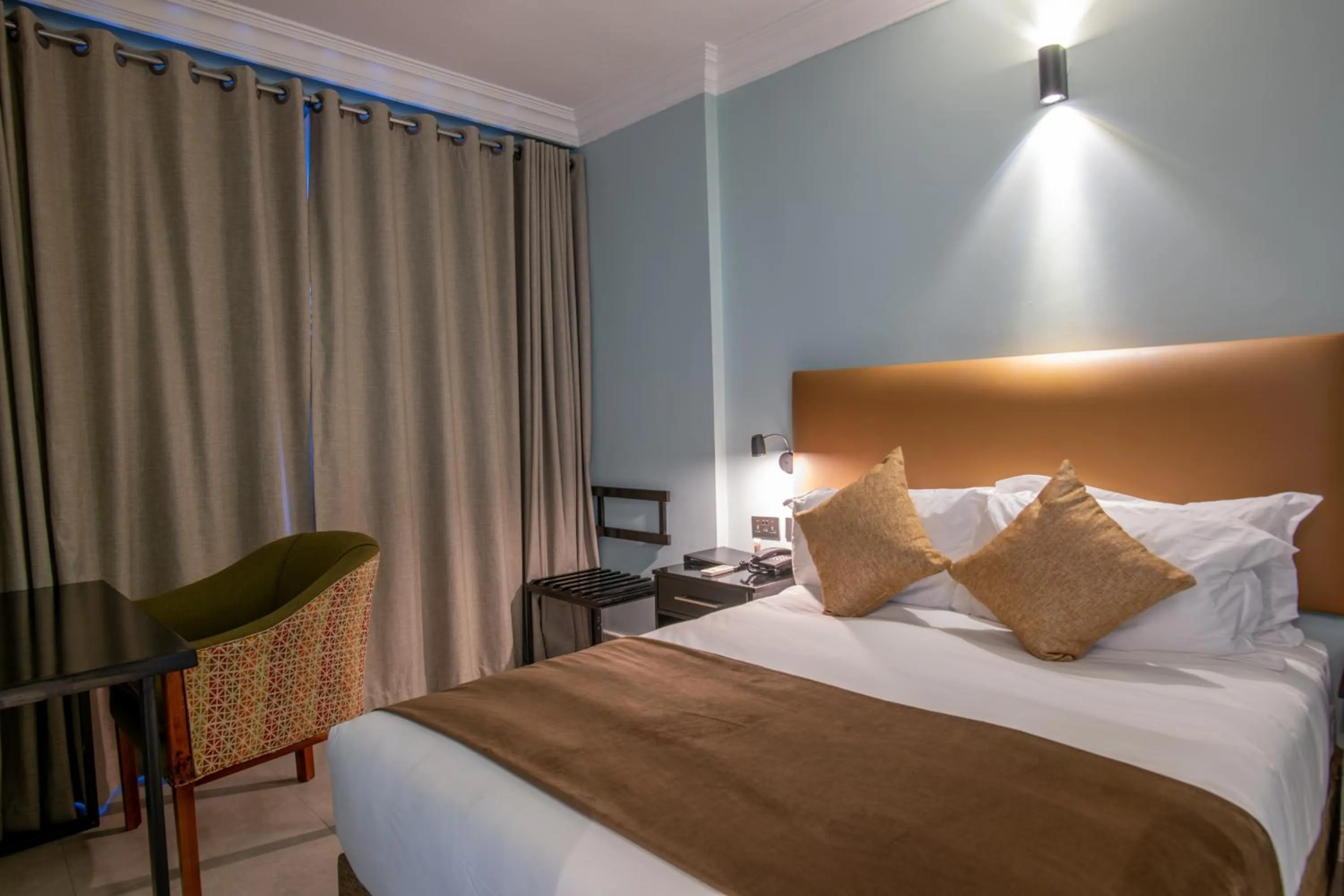 Bed in New Ambassador Hotel