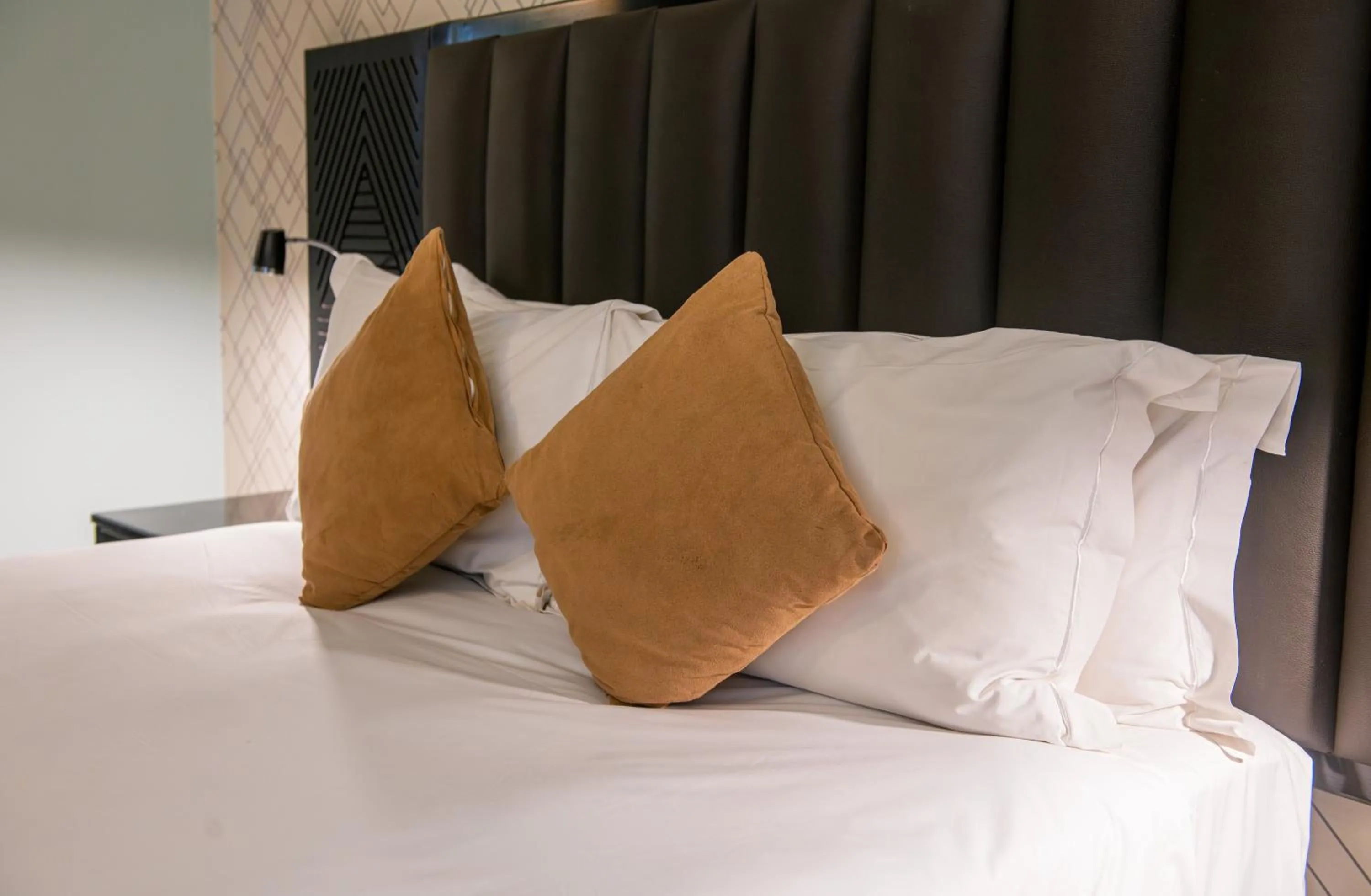 Bed in New Ambassador Hotel