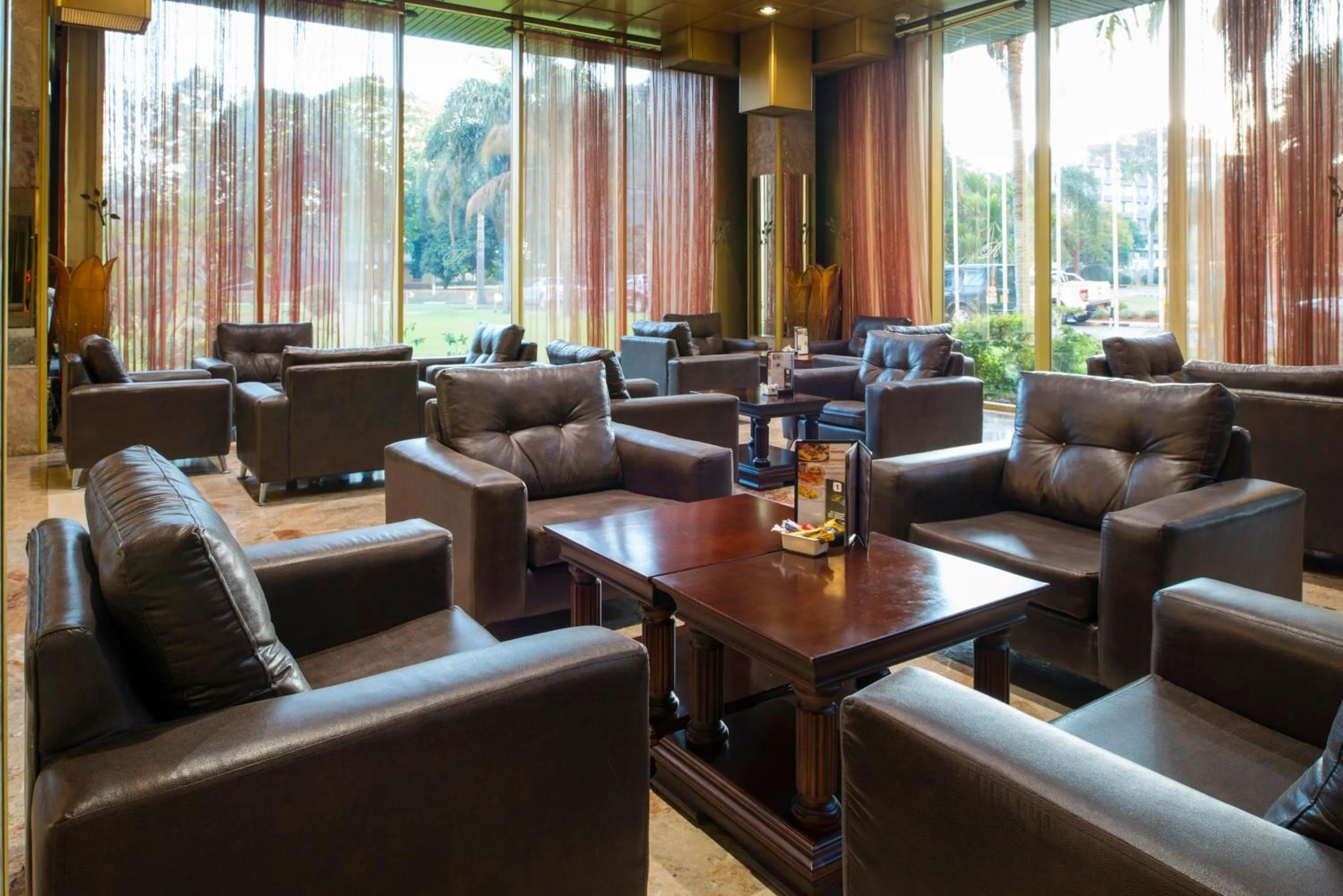 Communal lounge/ TV room in Rainbow Towers Hotel & Conference Centre