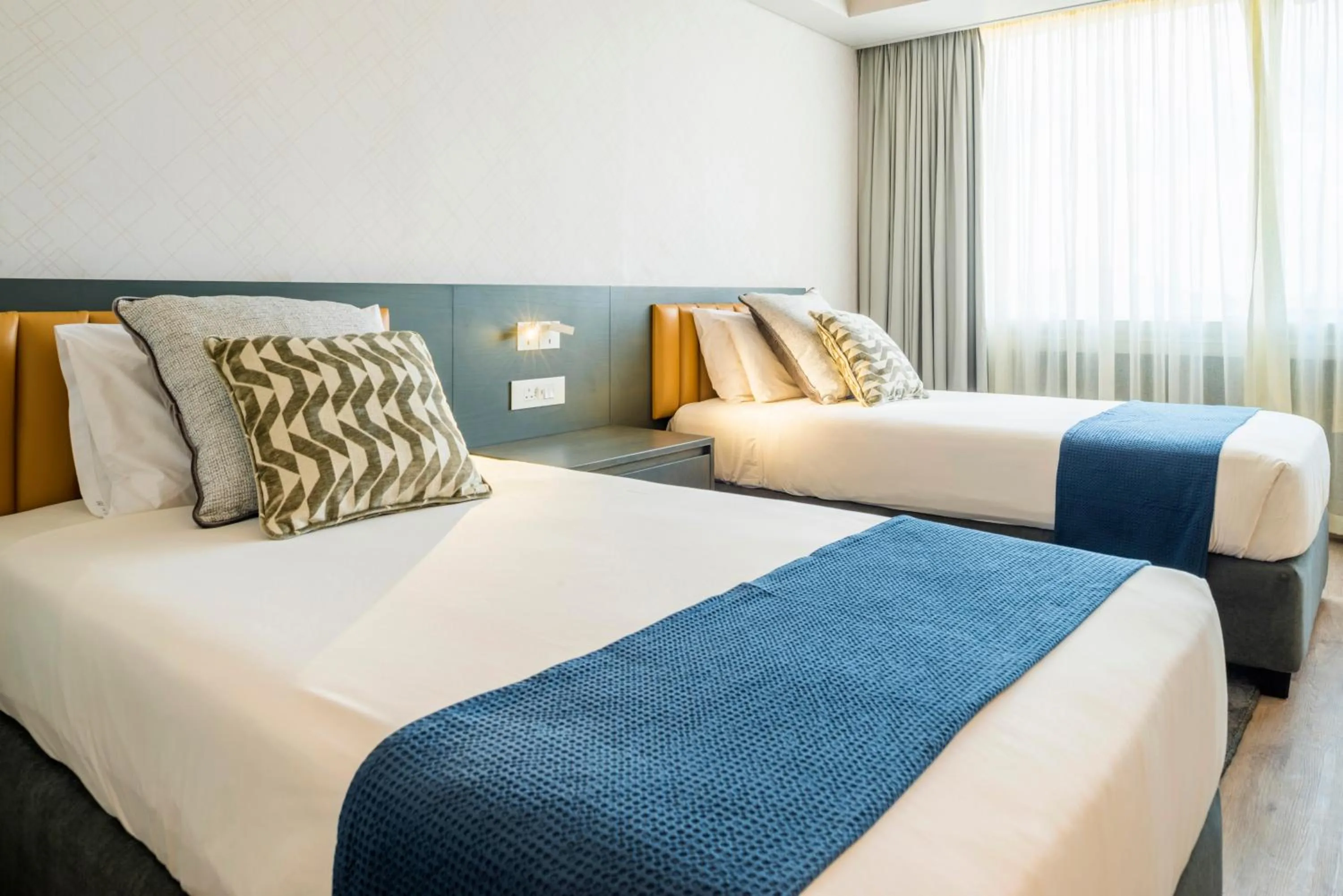 Bed in Rainbow Towers Hotel & Conference Centre