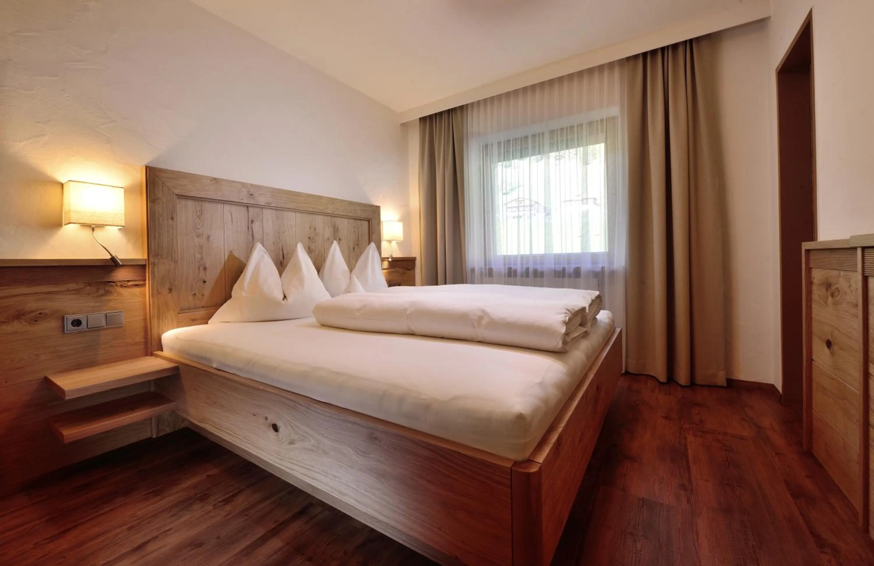 Bed in Aparthotel Garni Monte