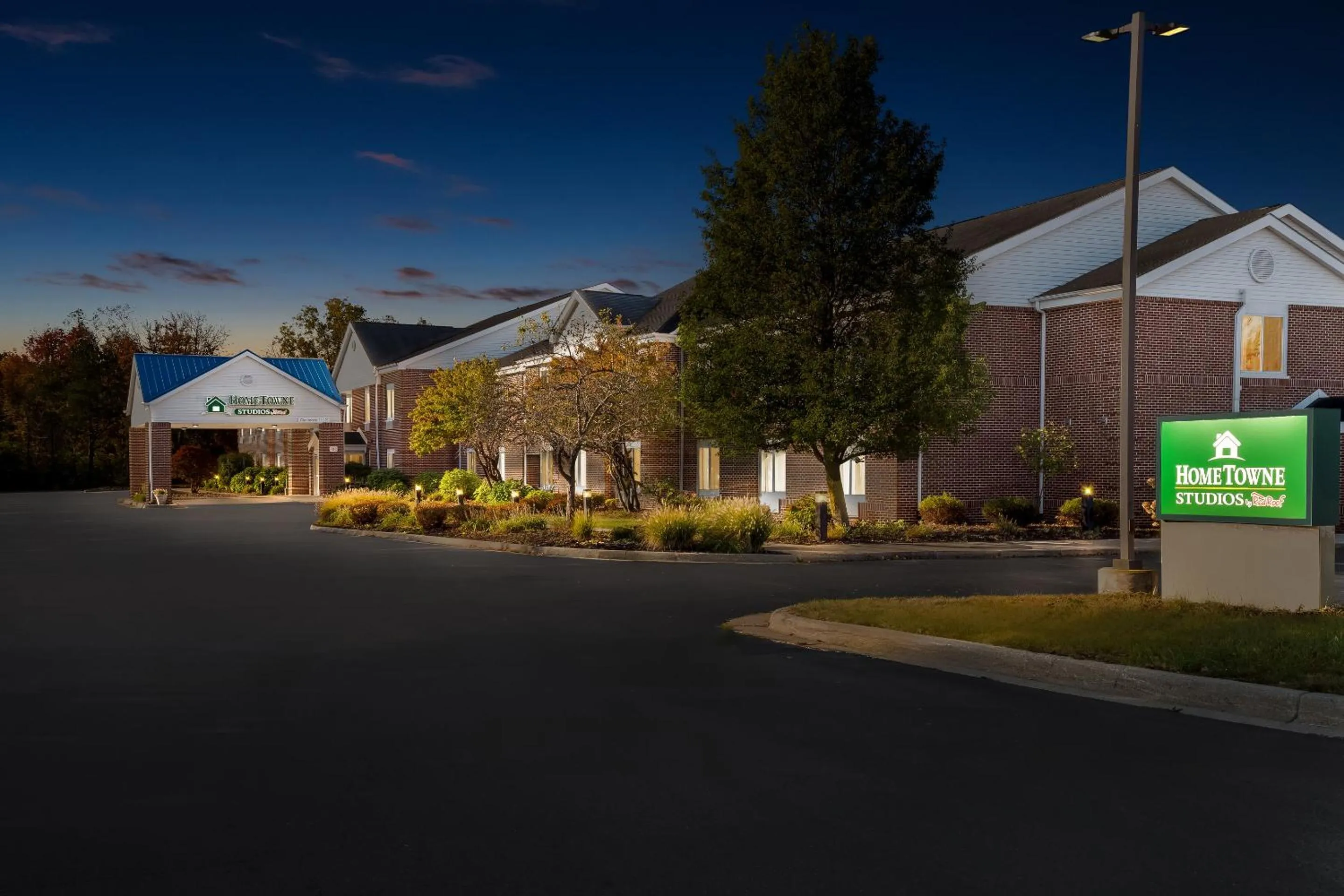 Property building in HomeTowne Studios by Red Roof East Lansing - Okemos