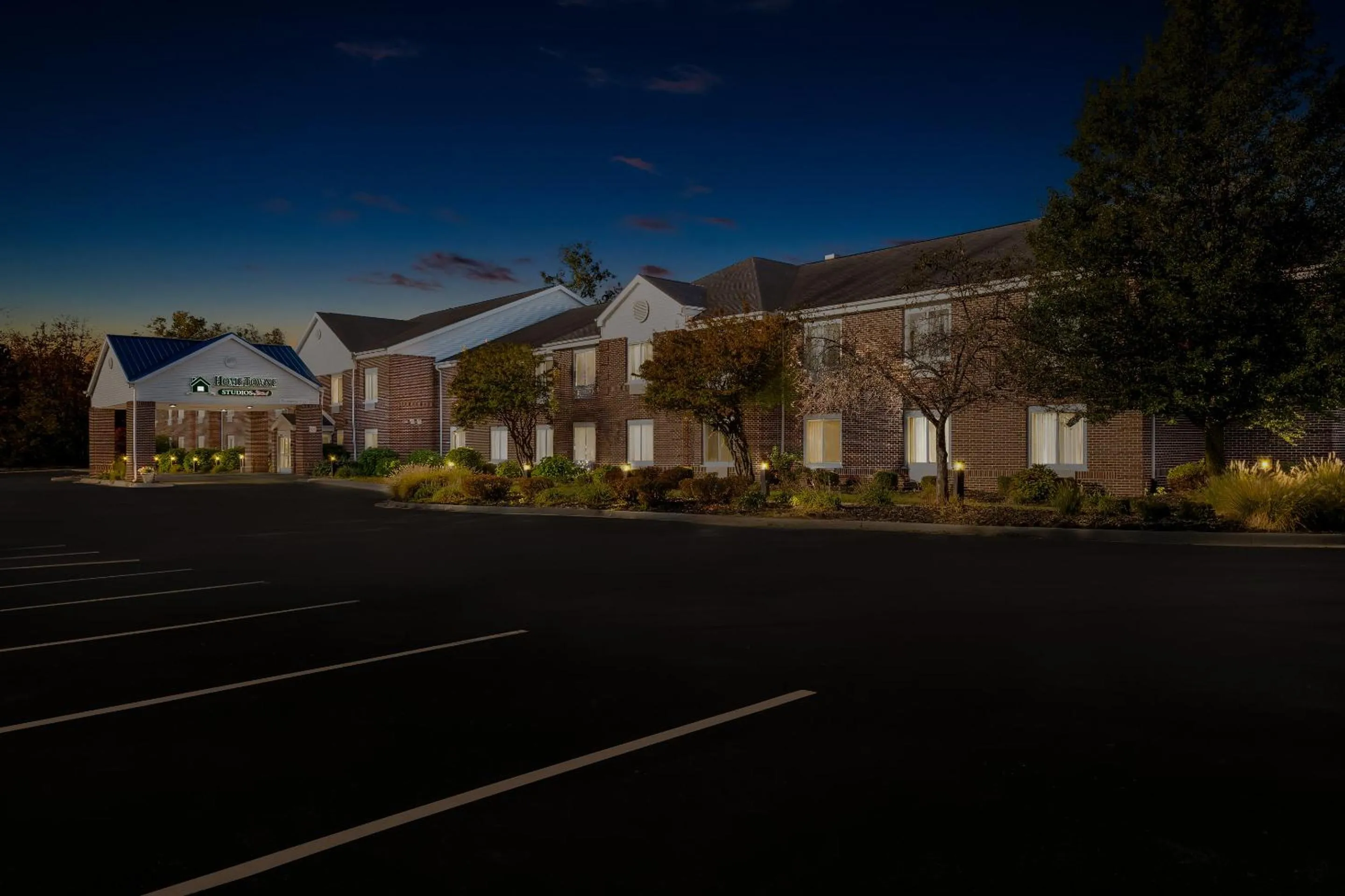 Property building in HomeTowne Studios by Red Roof East Lansing - Okemos