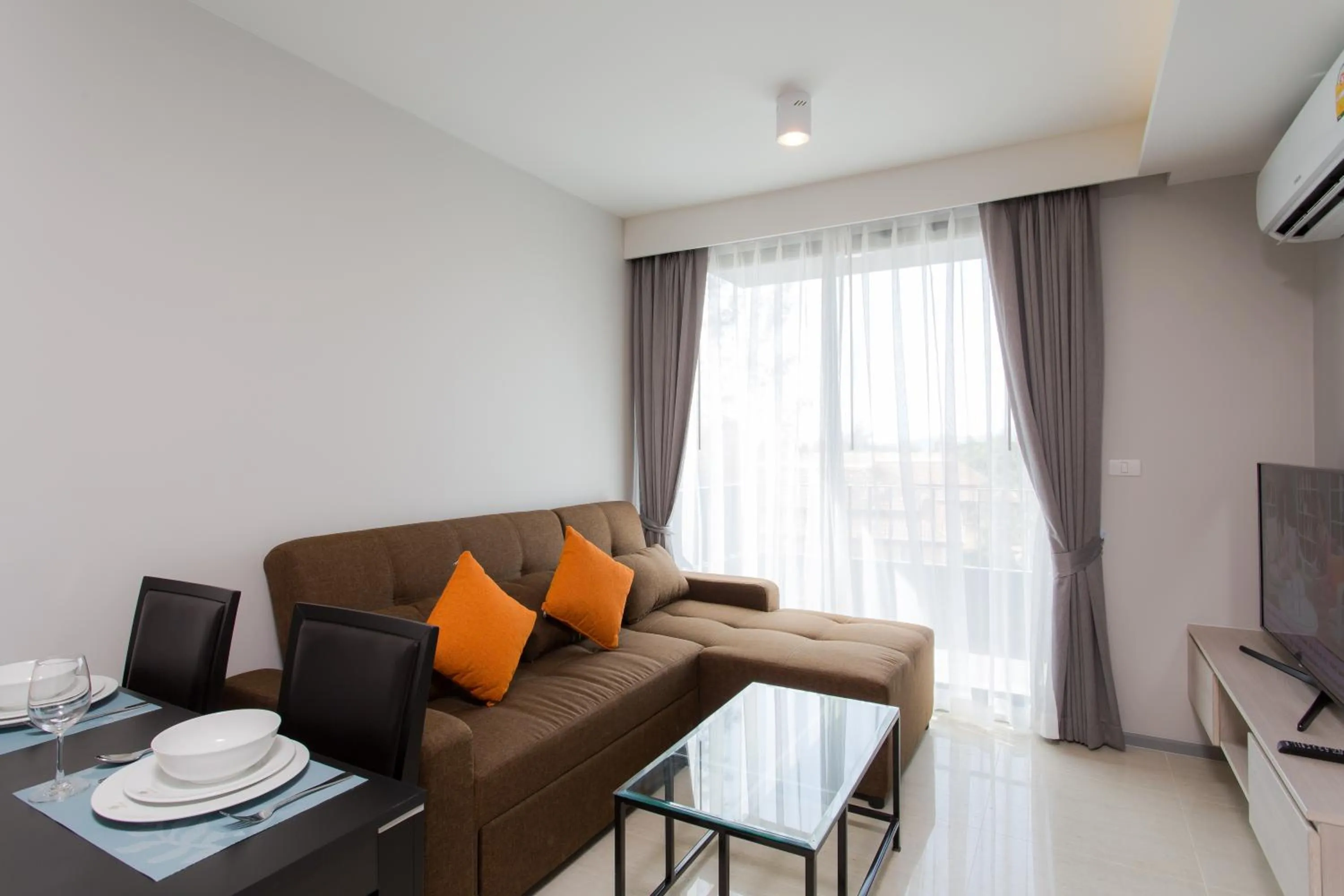 Living room in 6th Avenue Surin Beach - Official Account