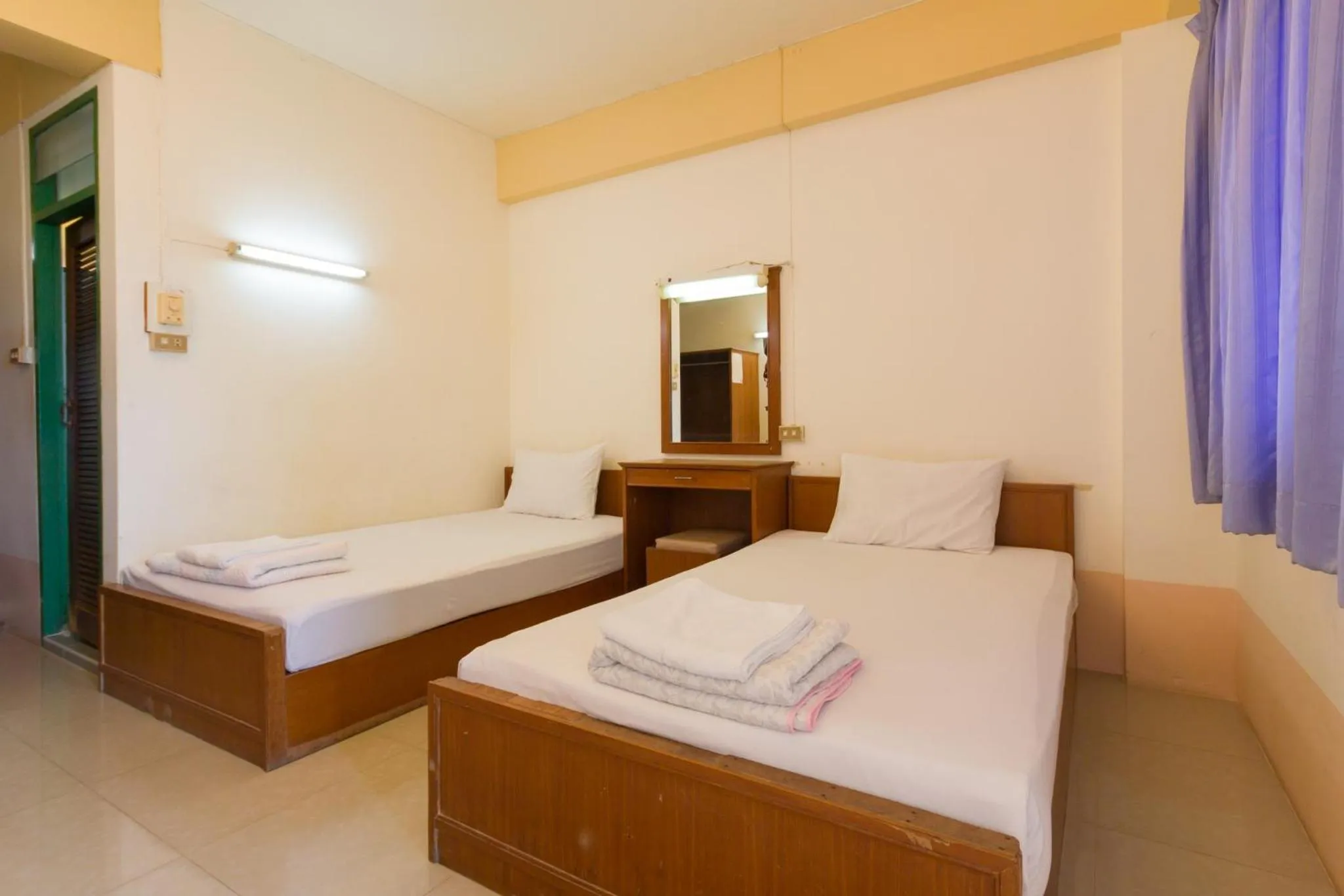 Bed in Mont Talay Hotel