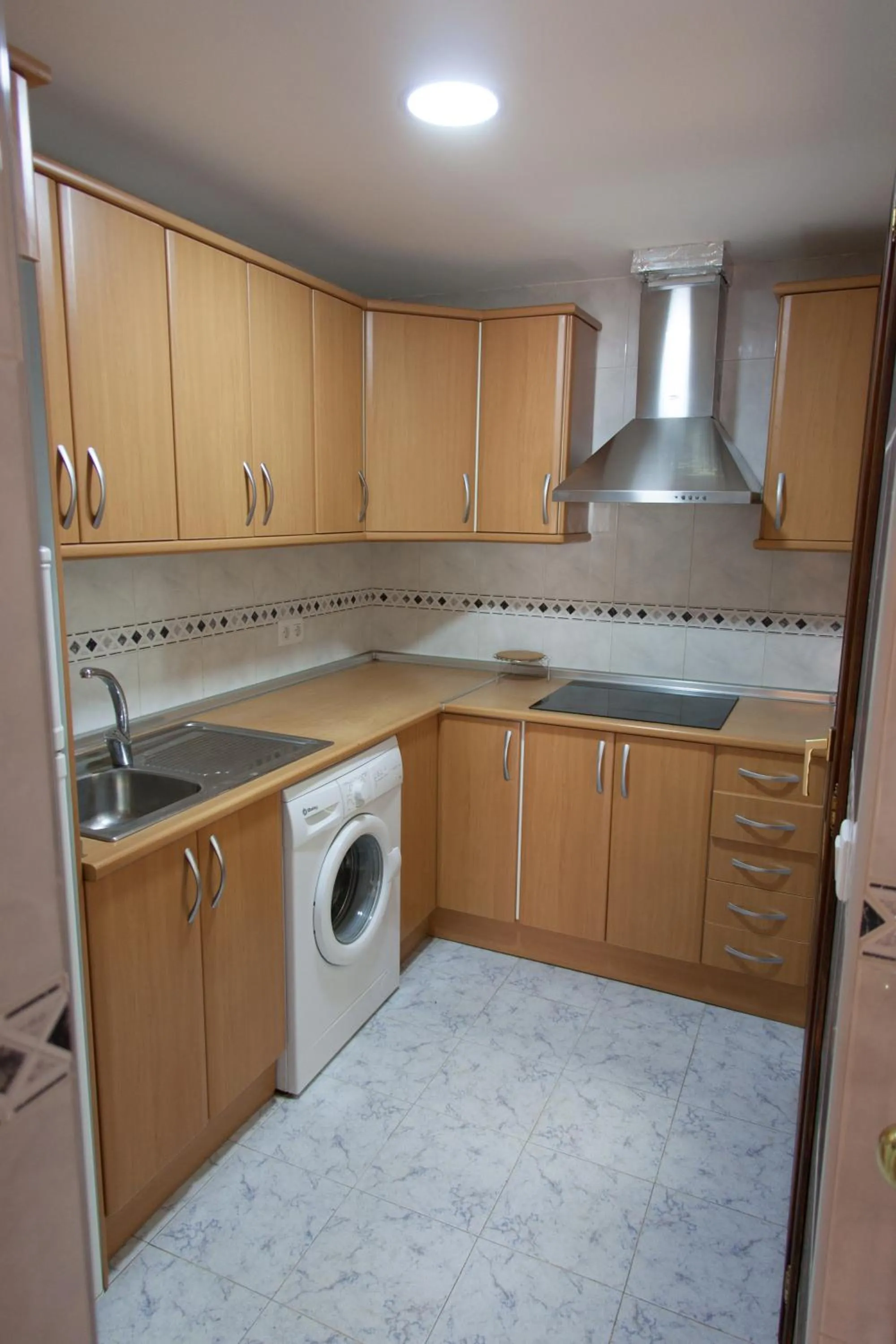 Kitchen or kitchenette in Apartamentos Río Guadalaviar