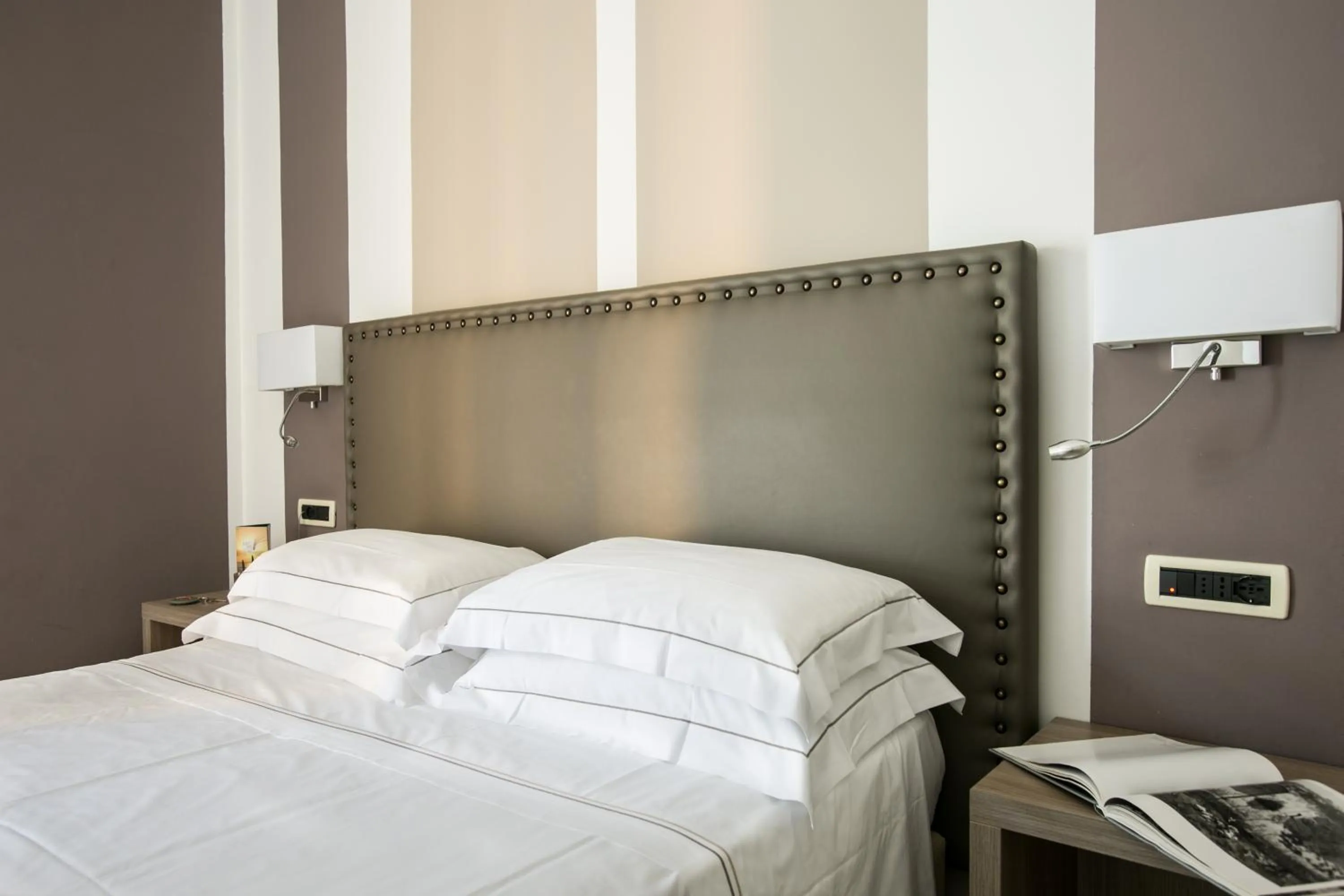 Bed in Hotel Arc En Ciel