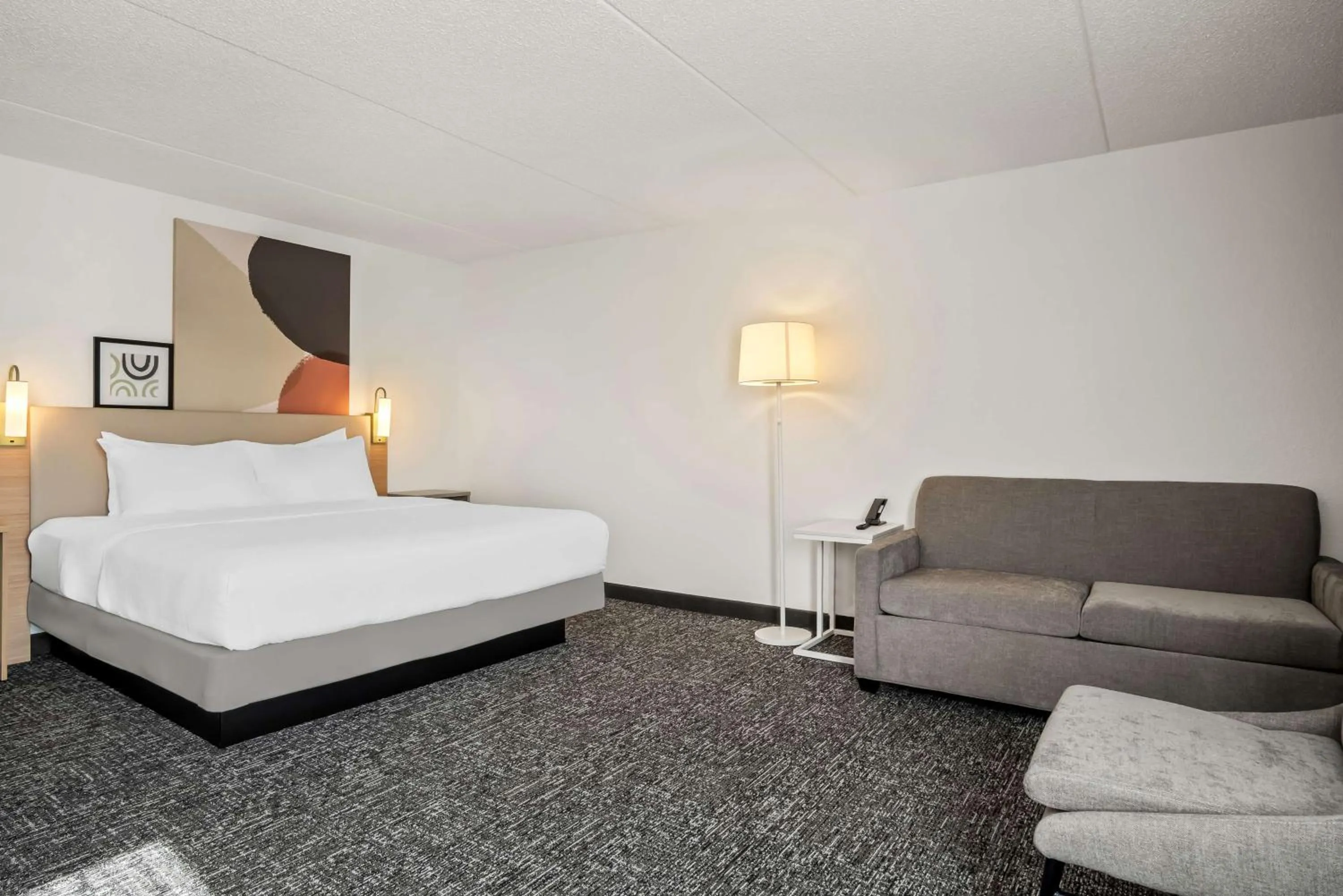 Living room, Bed in Spark By Hilton Stevensville