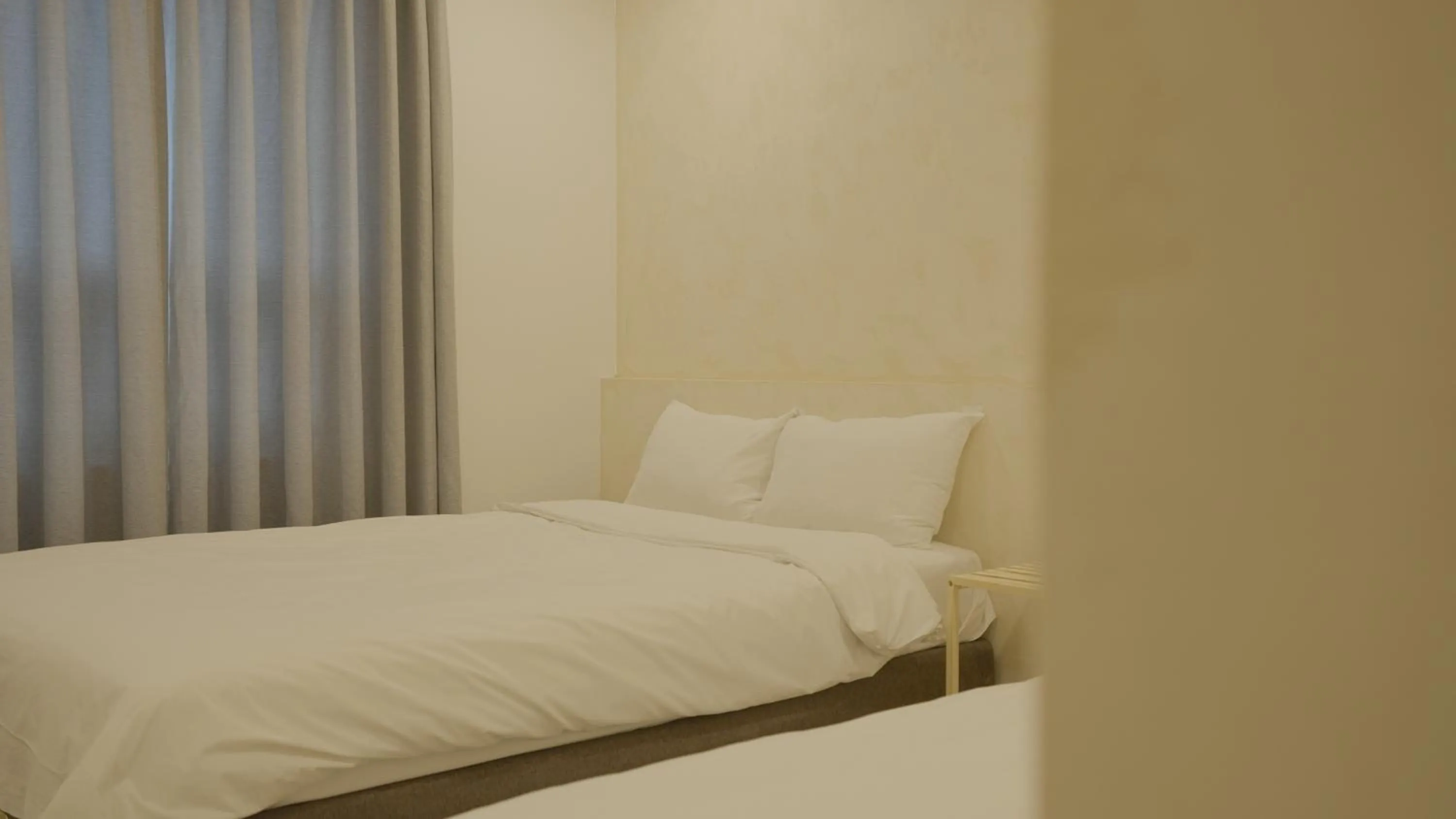 Bed in Jeju Stay Hotel