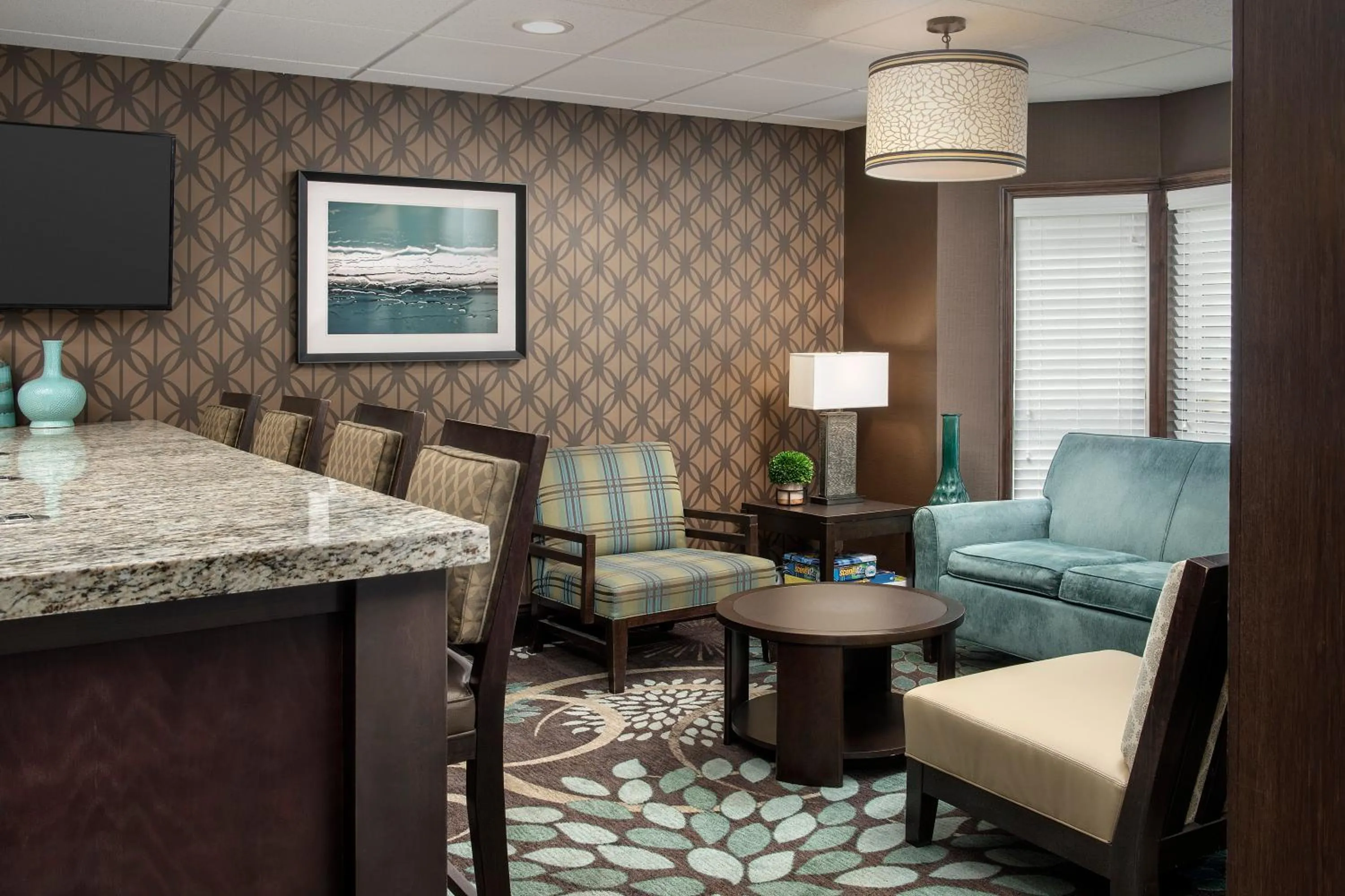 Communal lounge/ TV room in Staybridge Suites Greenville I-85 Woodruff Road by IHG
