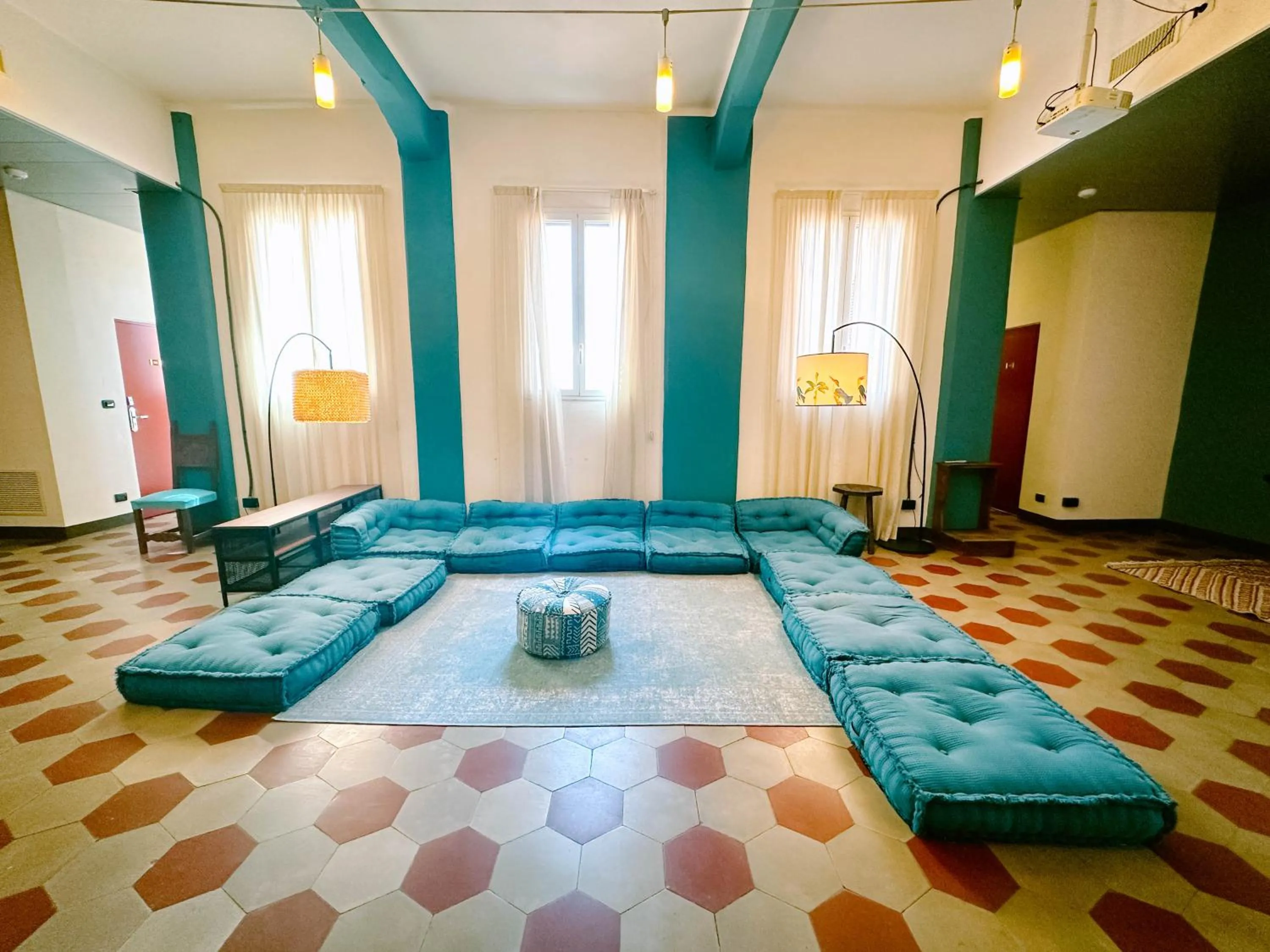 Seating area in Hotel Bello by Ostello Bello