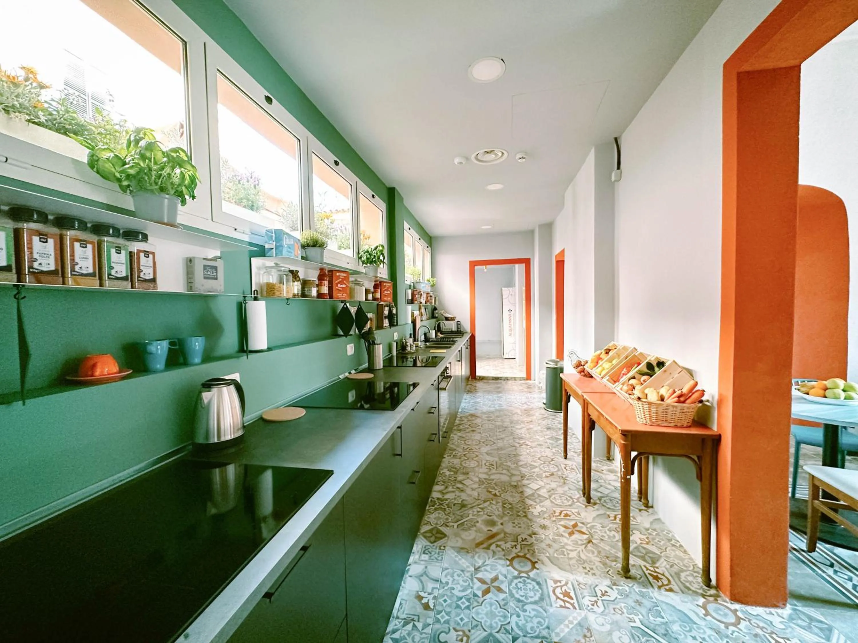 Communal kitchen in Hotel Bello by Ostello Bello