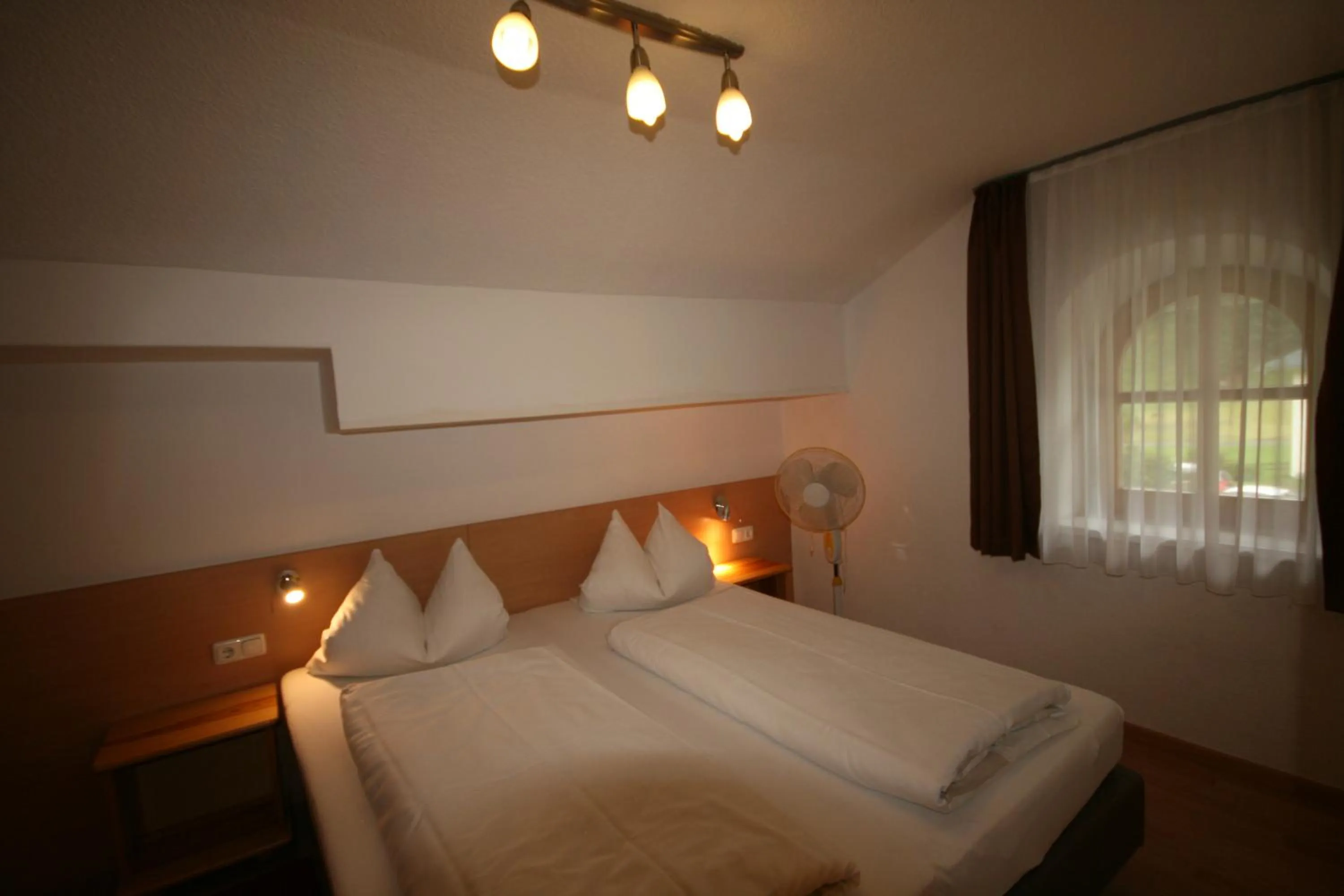 Bedroom, Bed in Familienappartements Eder - Free entry to Tauern SPA Kaprun included