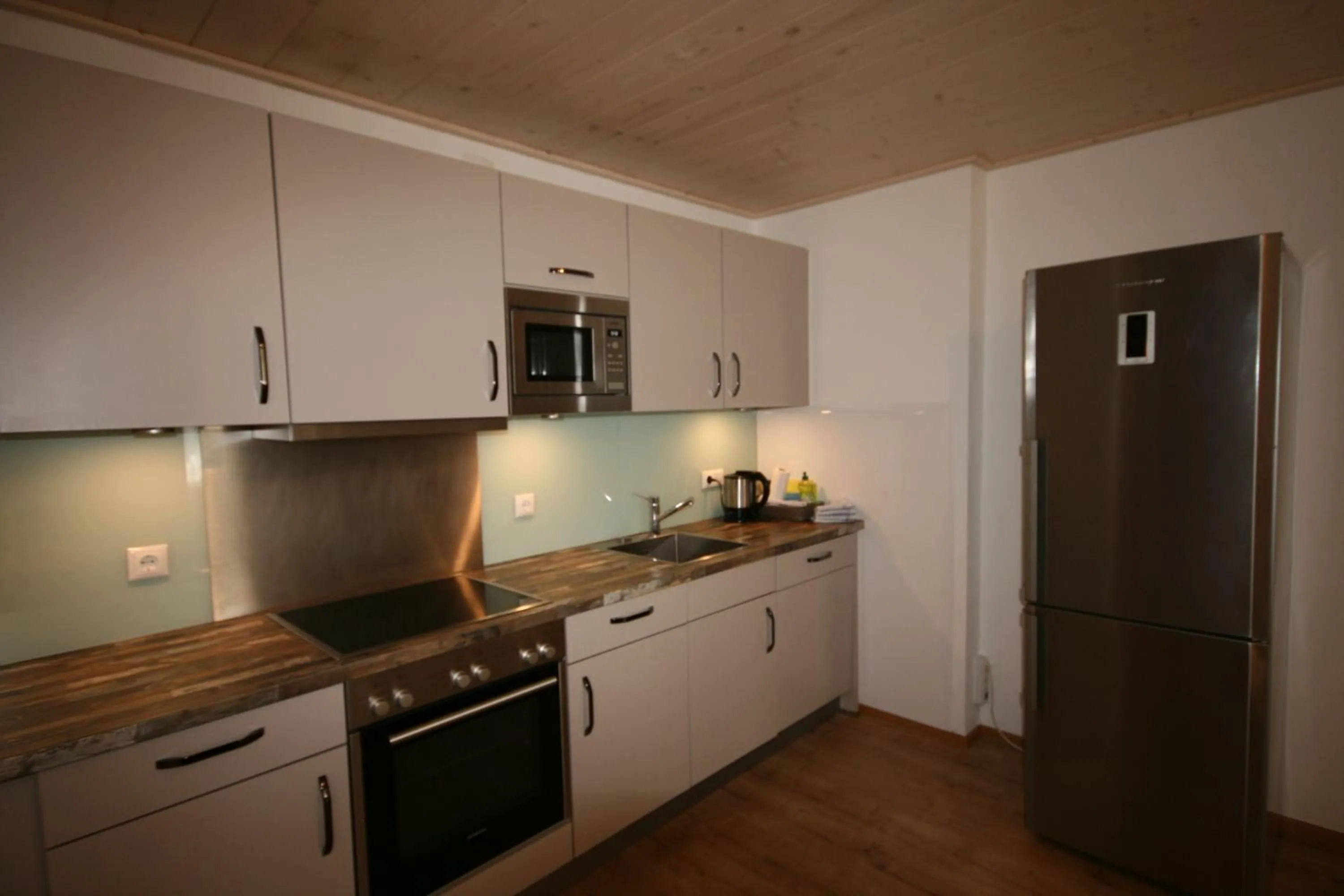 Kitchen or kitchenette in Familienappartements Eder - Free entry to Tauern SPA Kaprun included