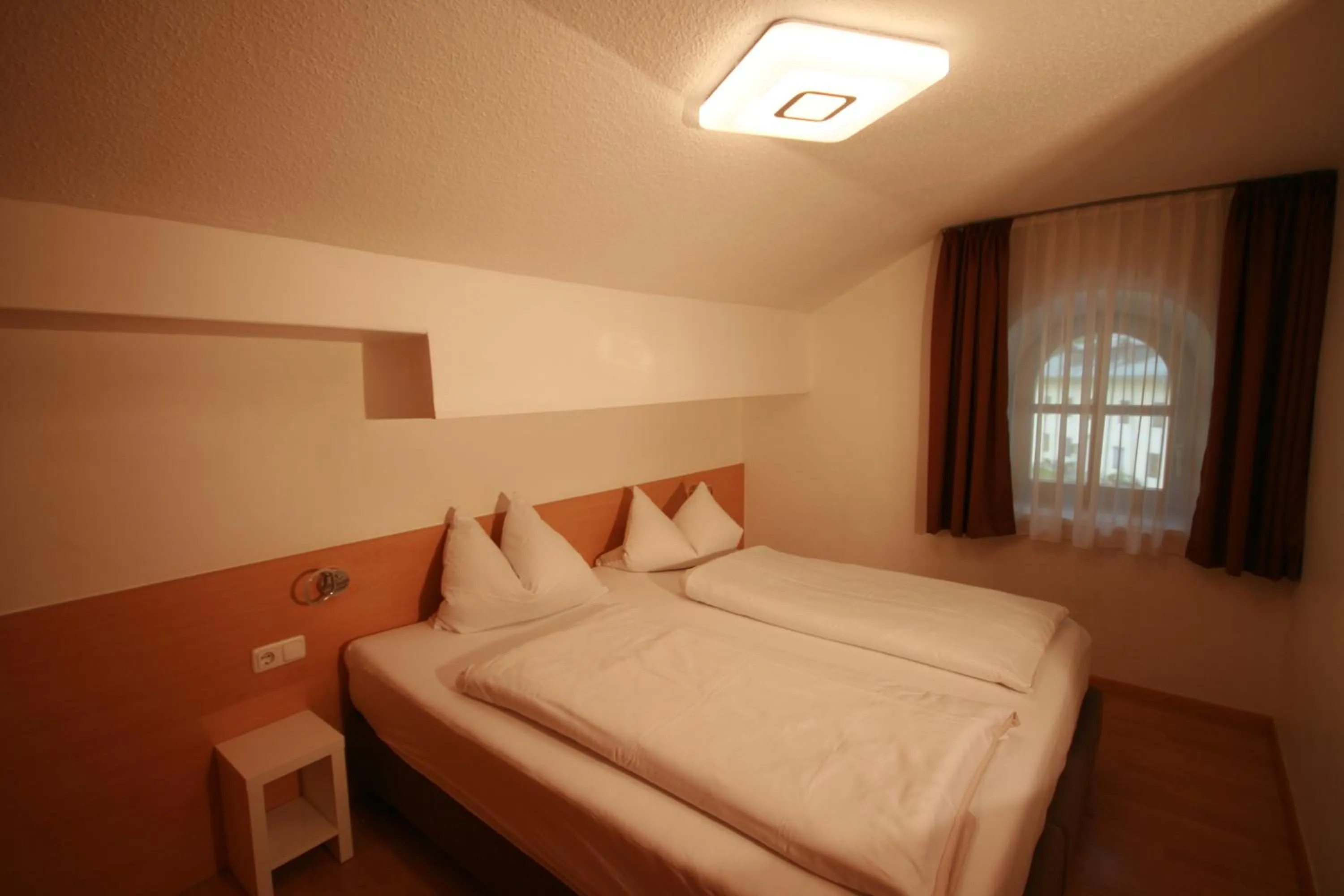 Bedroom, Bed in Familienappartements Eder - Free entry to Tauern SPA Kaprun included