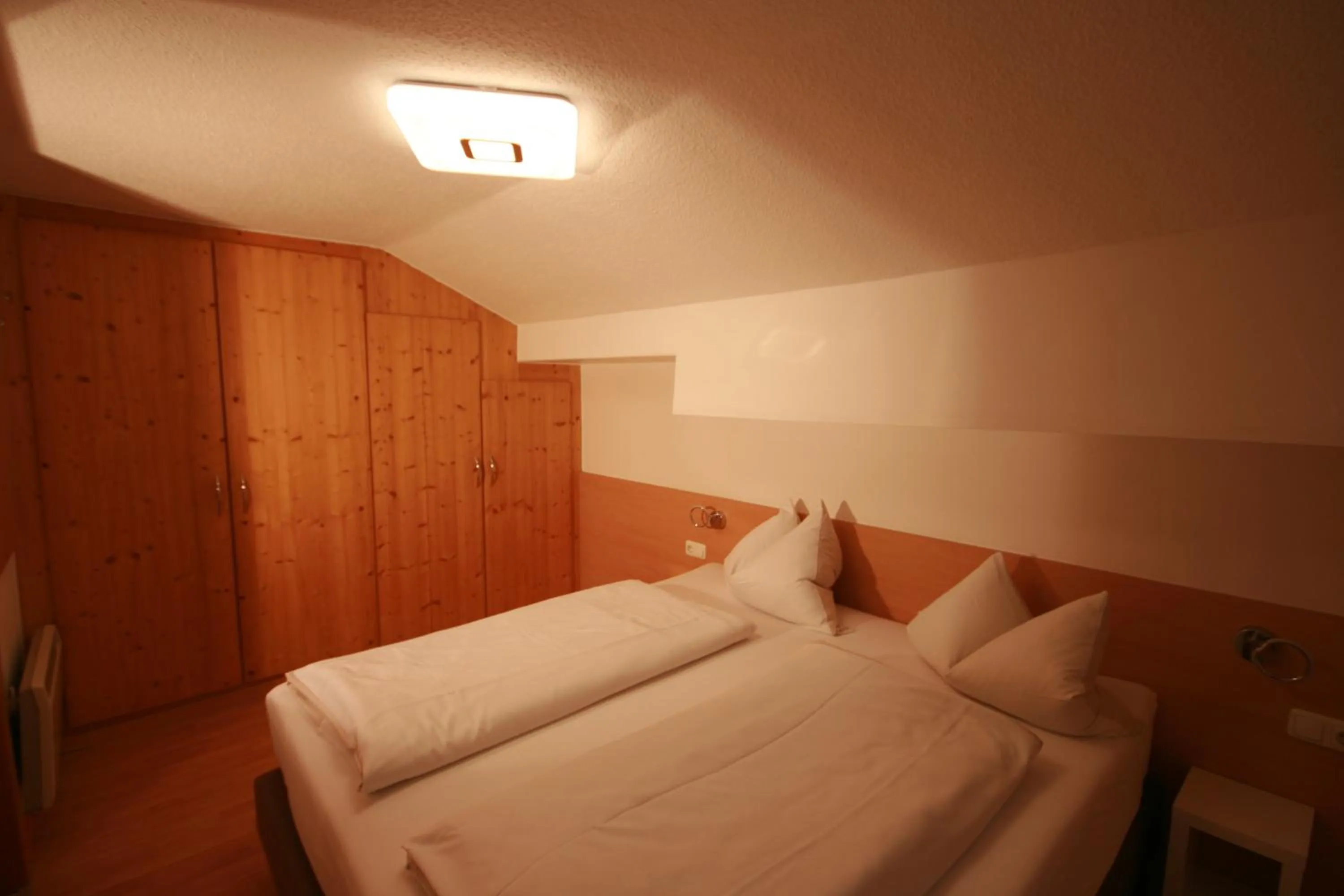 Bedroom, Bed in Familienappartements Eder - Free entry to Tauern SPA Kaprun included