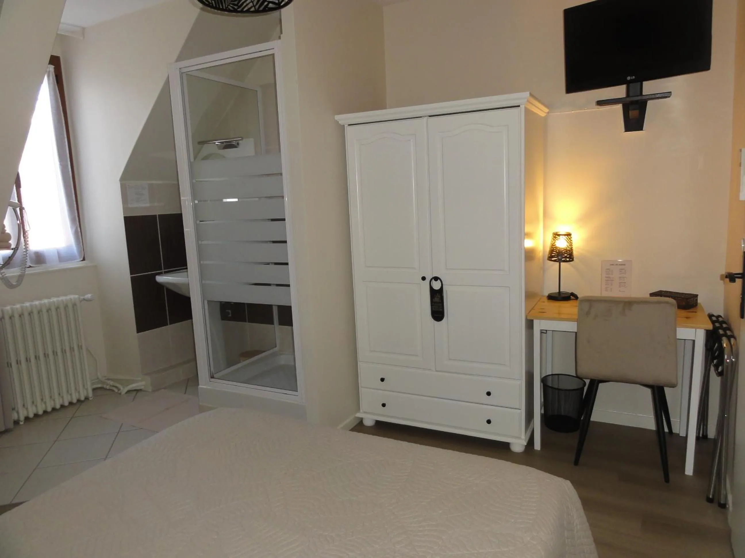 Bed in Hotel des Voyageurs
