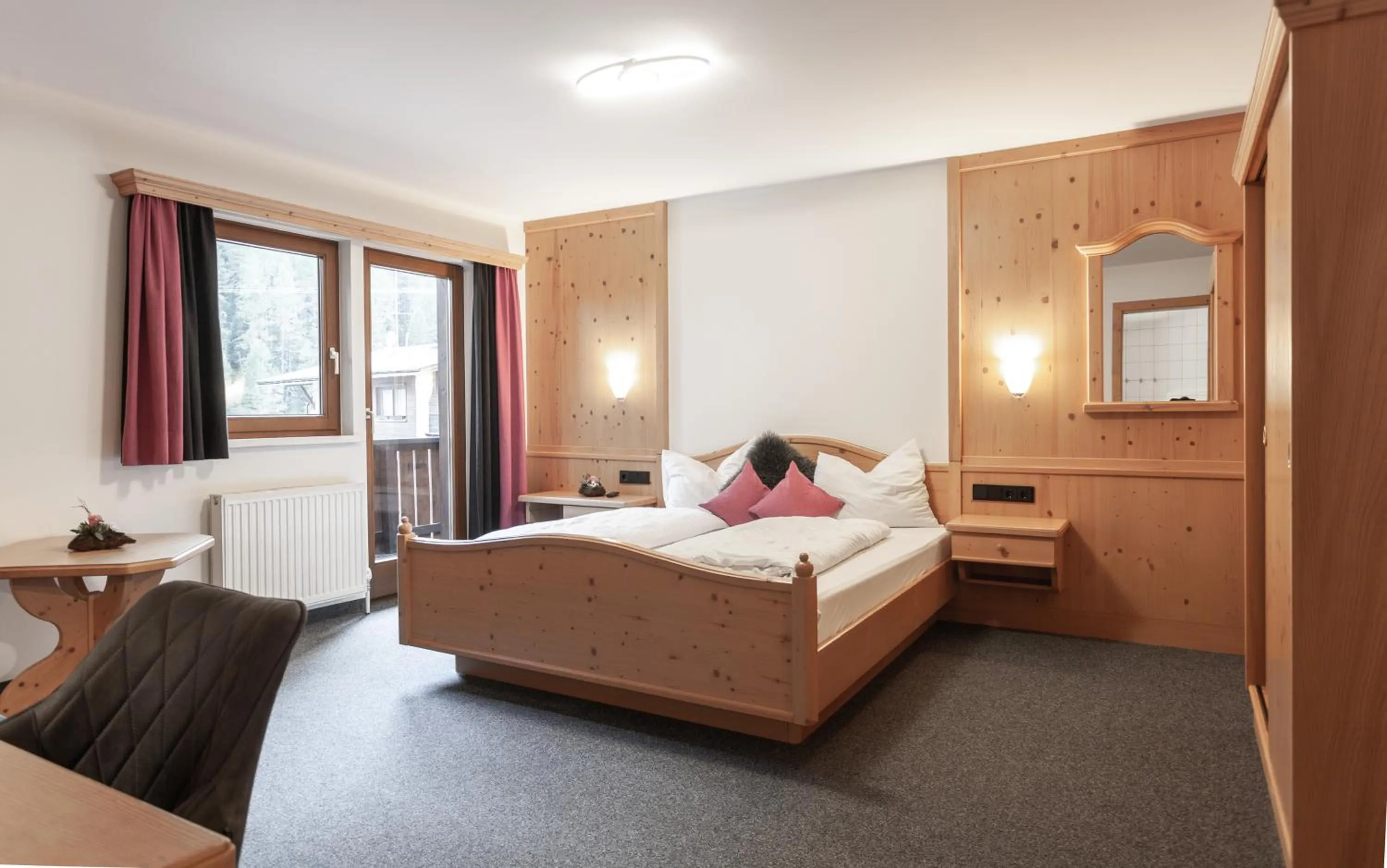 Photo of the whole room, Bed in first mountain Hotel Ötztal