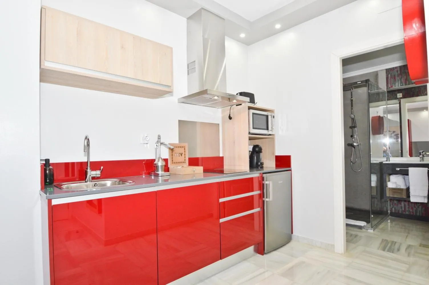 Kitchen or kitchenette in The Zentral Arenal Suites