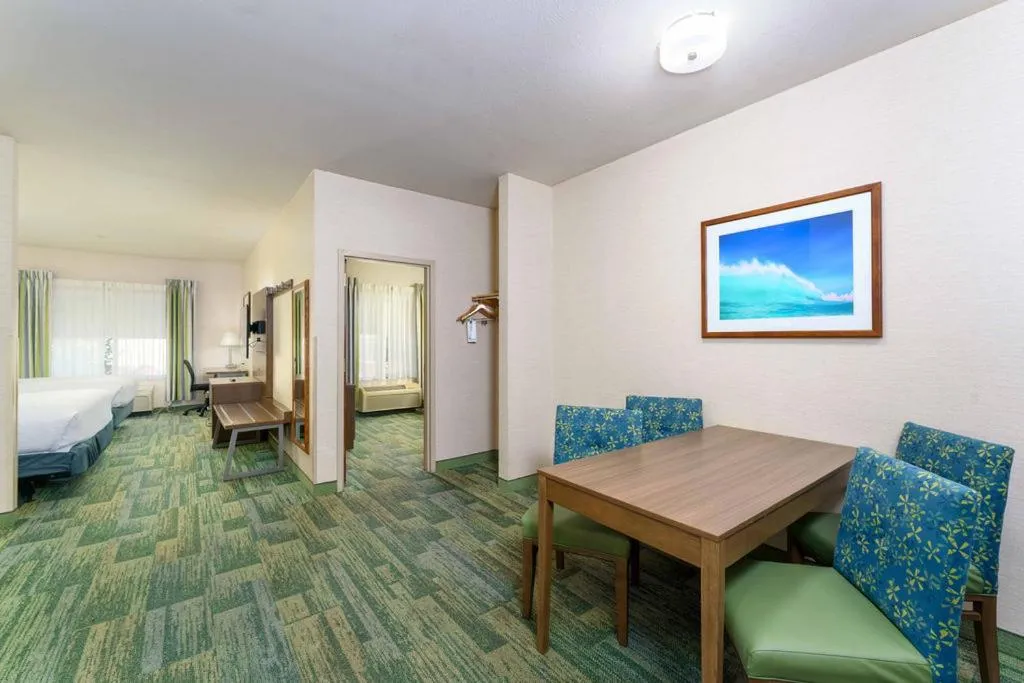 Bed in Triple Play Resort Hotel & Suites