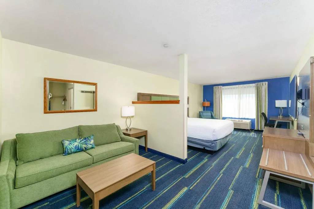 Bed in Triple Play Resort Hotel & Suites
