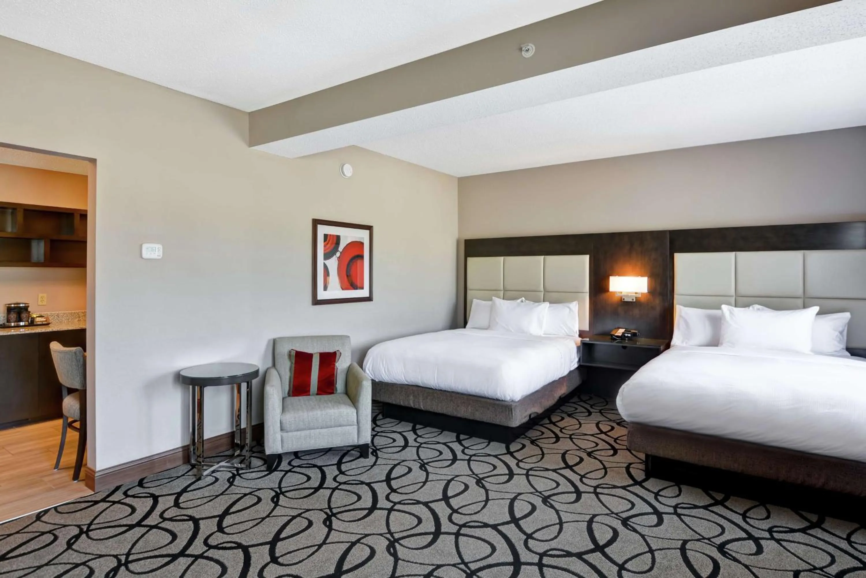 Living room, Bed in DoubleTree by Hilton Hattiesburg, MS