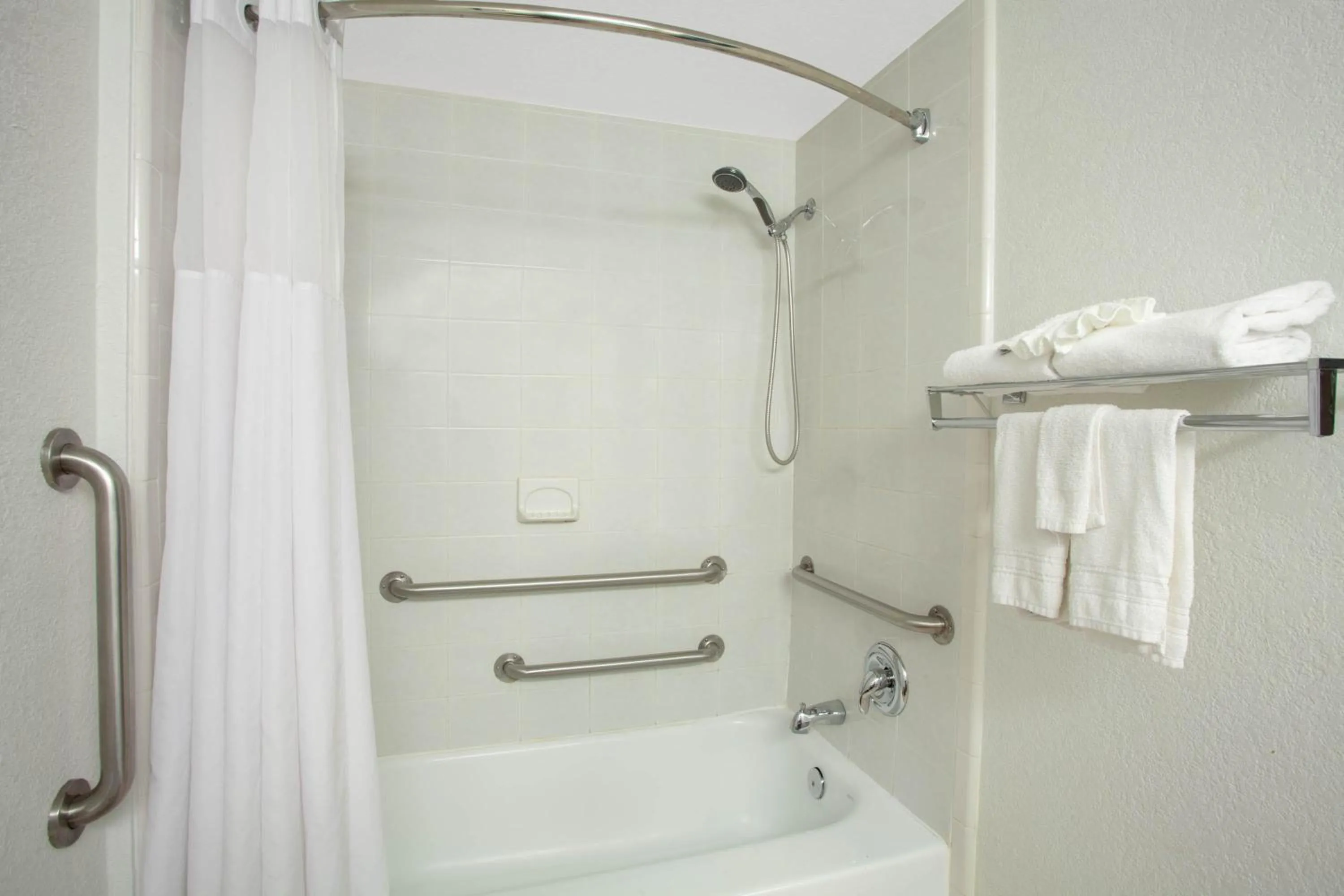 Bathroom in Ramada by Wyndham Davenport Orlando South