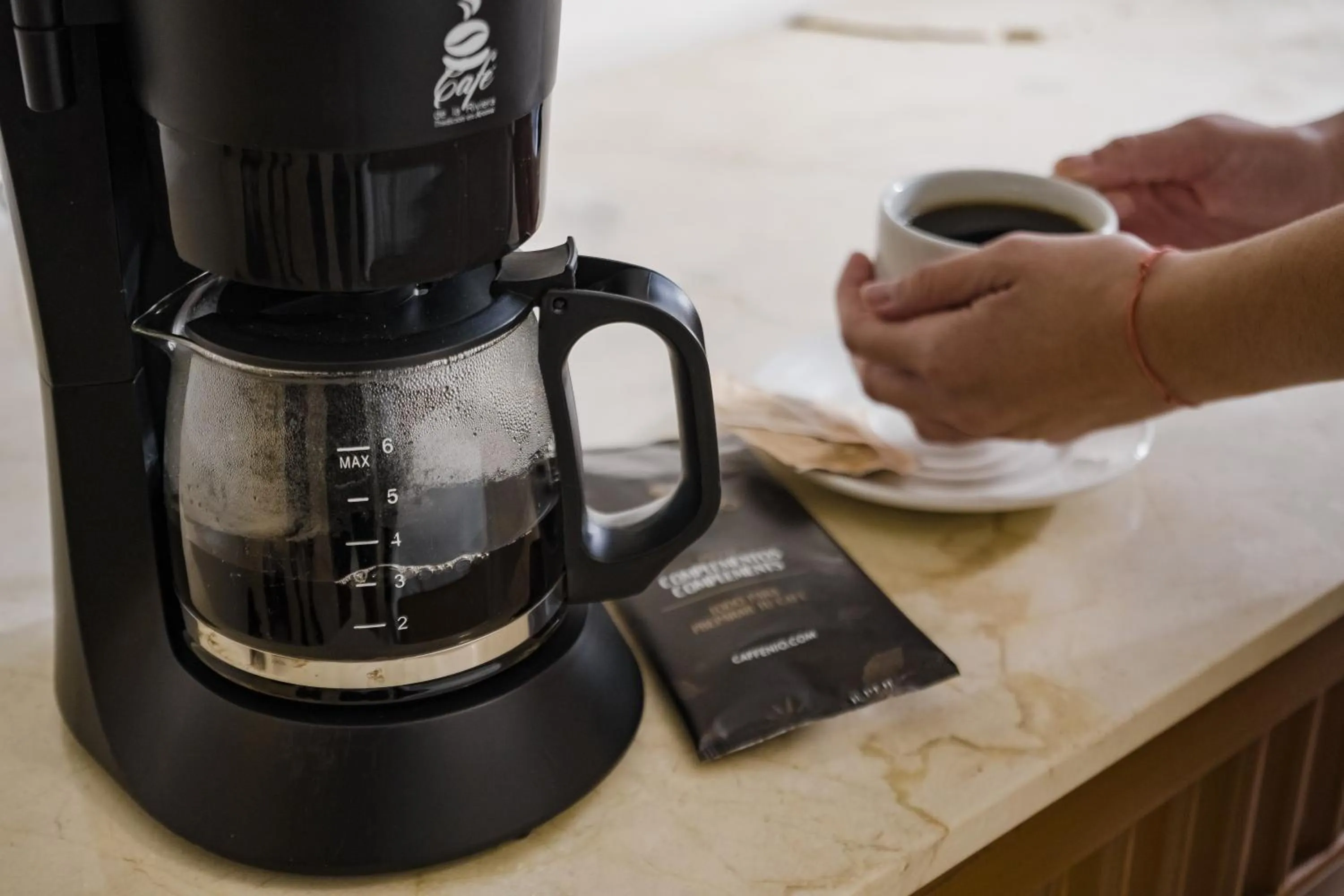 Coffee/tea facilities in The Reef Coco Beach Resort & Spa- Optional All Inclusive