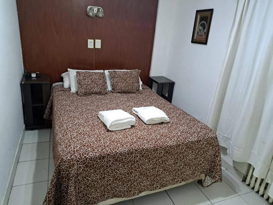 Bed in San Remo Grand Hotel