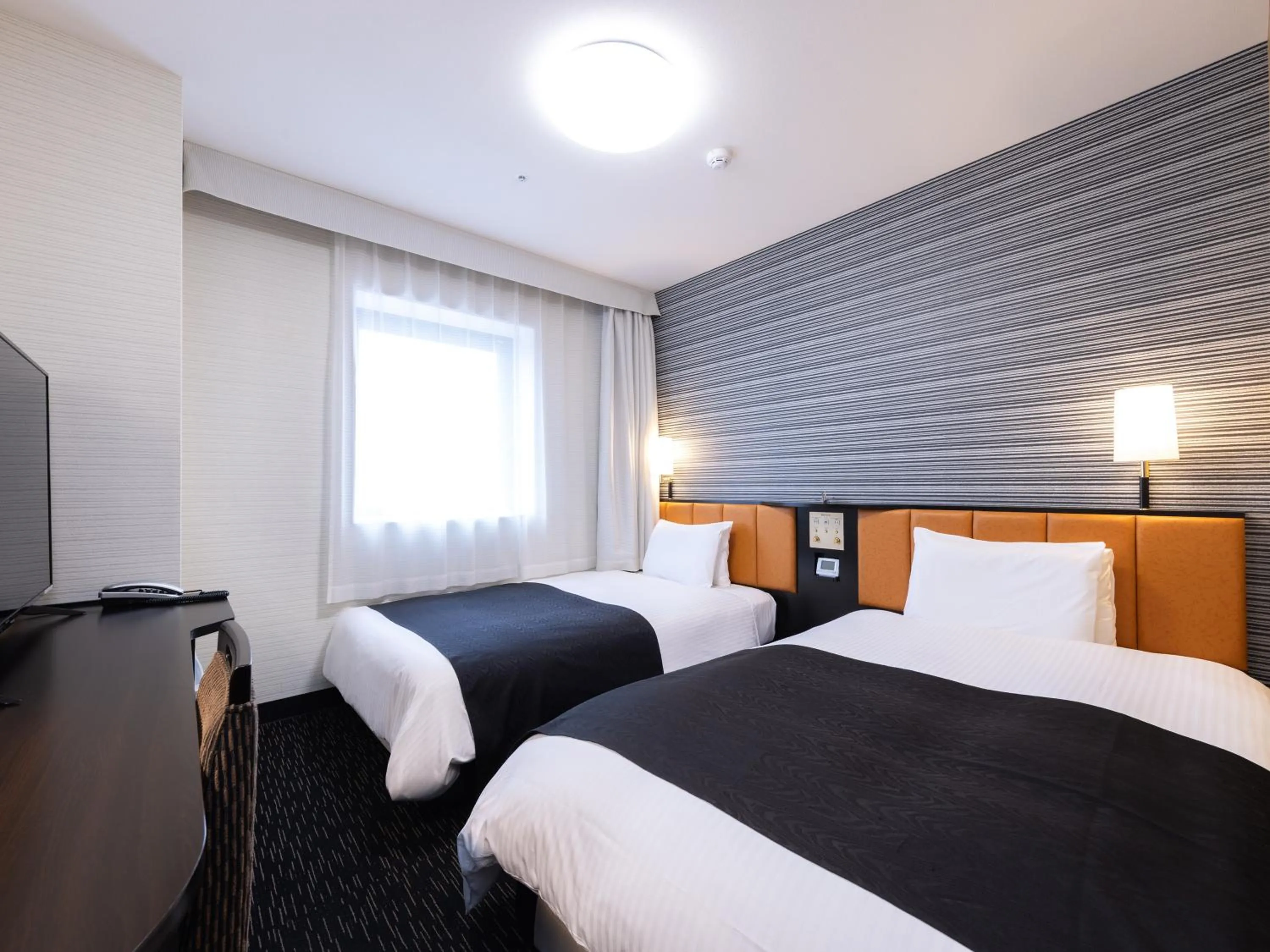 Bed in APA Hotel Yamagata Tsuruoka Ekimae