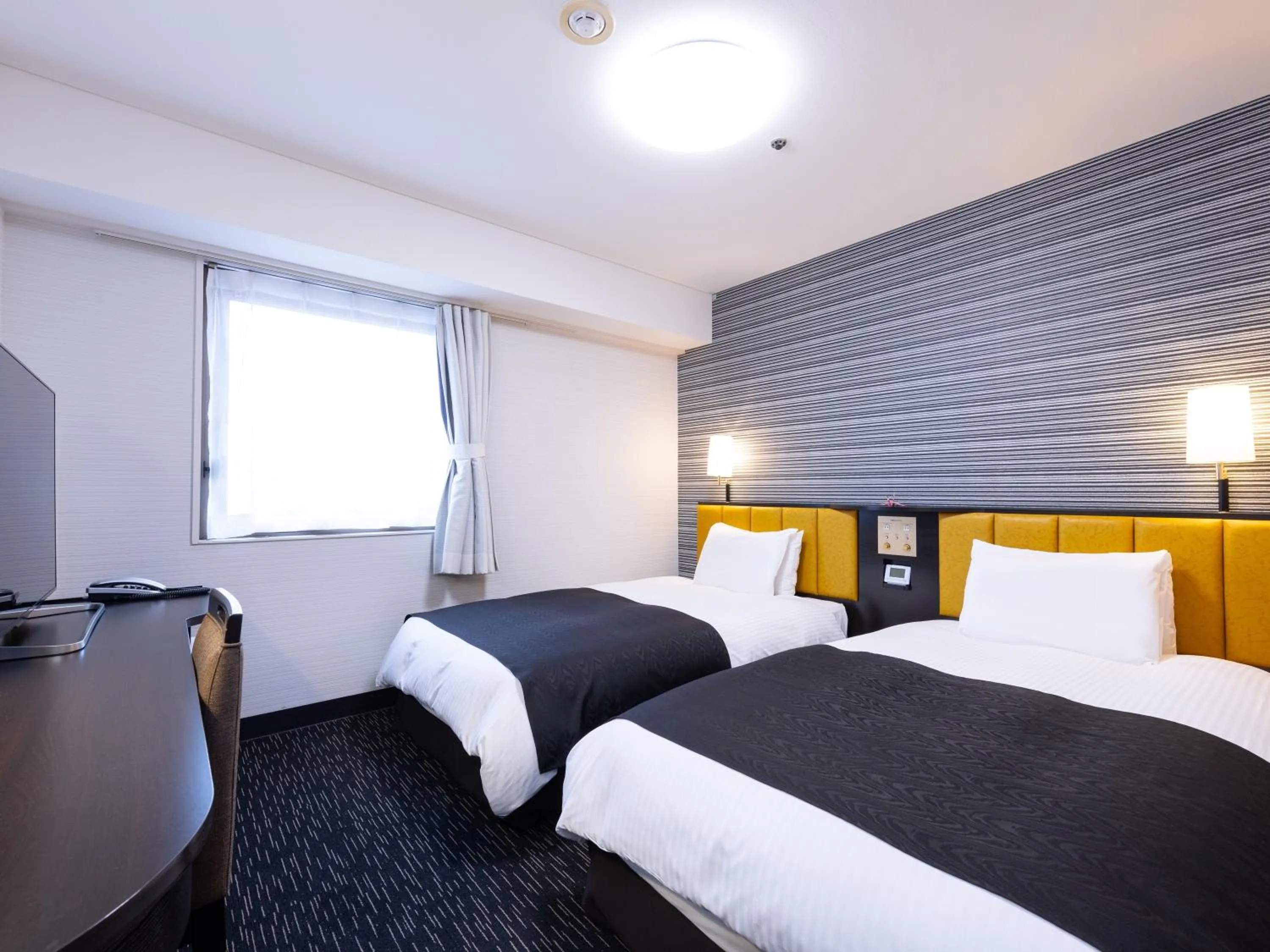 Bed in APA Hotel Yamagata Tsuruoka Ekimae