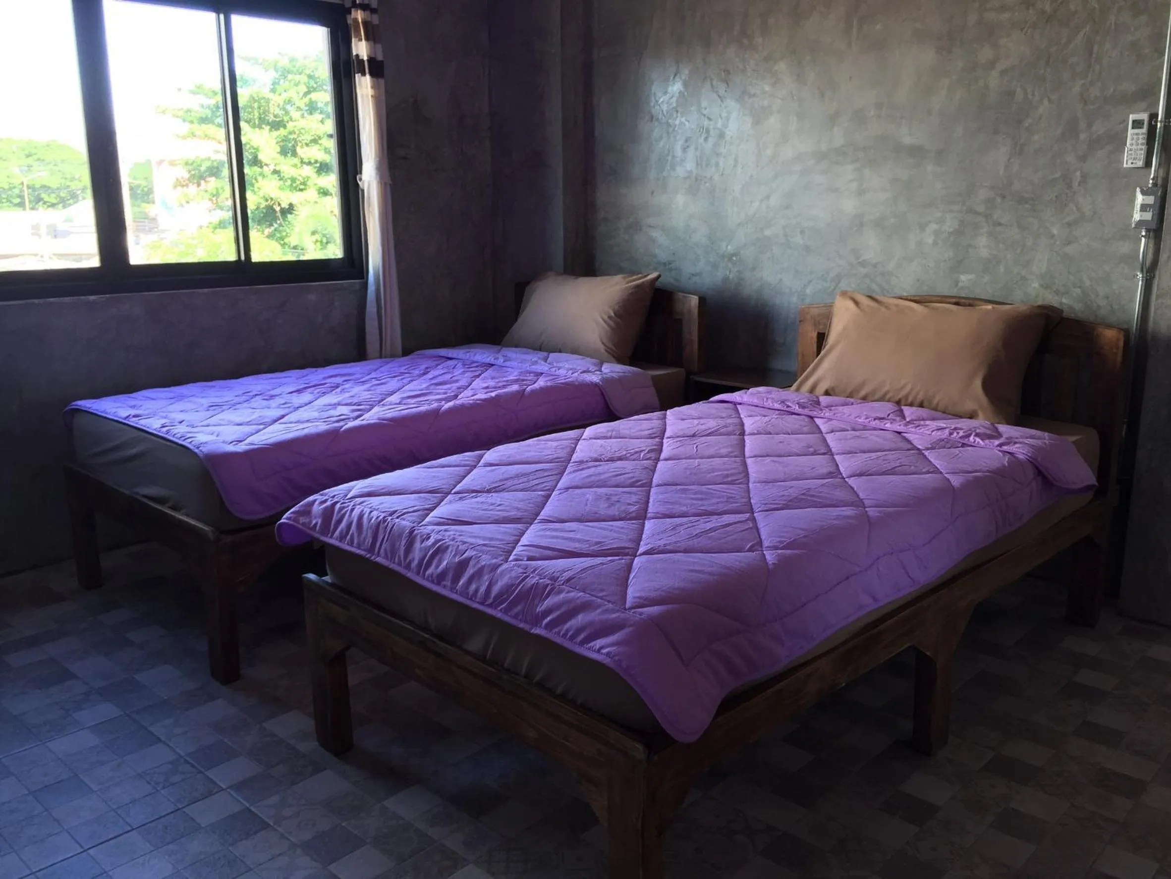 Bed in Chiangmai HomeTeL