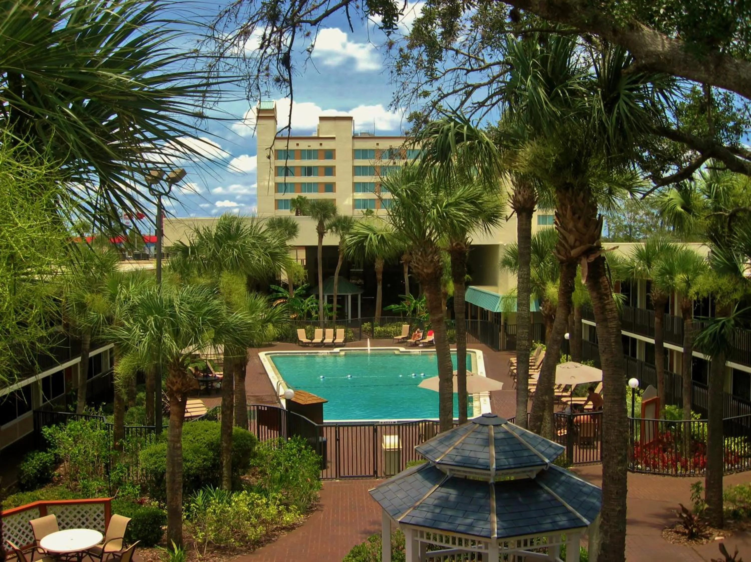 Property building in Ramada by Wyndham Kissimmee Gateway - Free Theme Park Shuttle