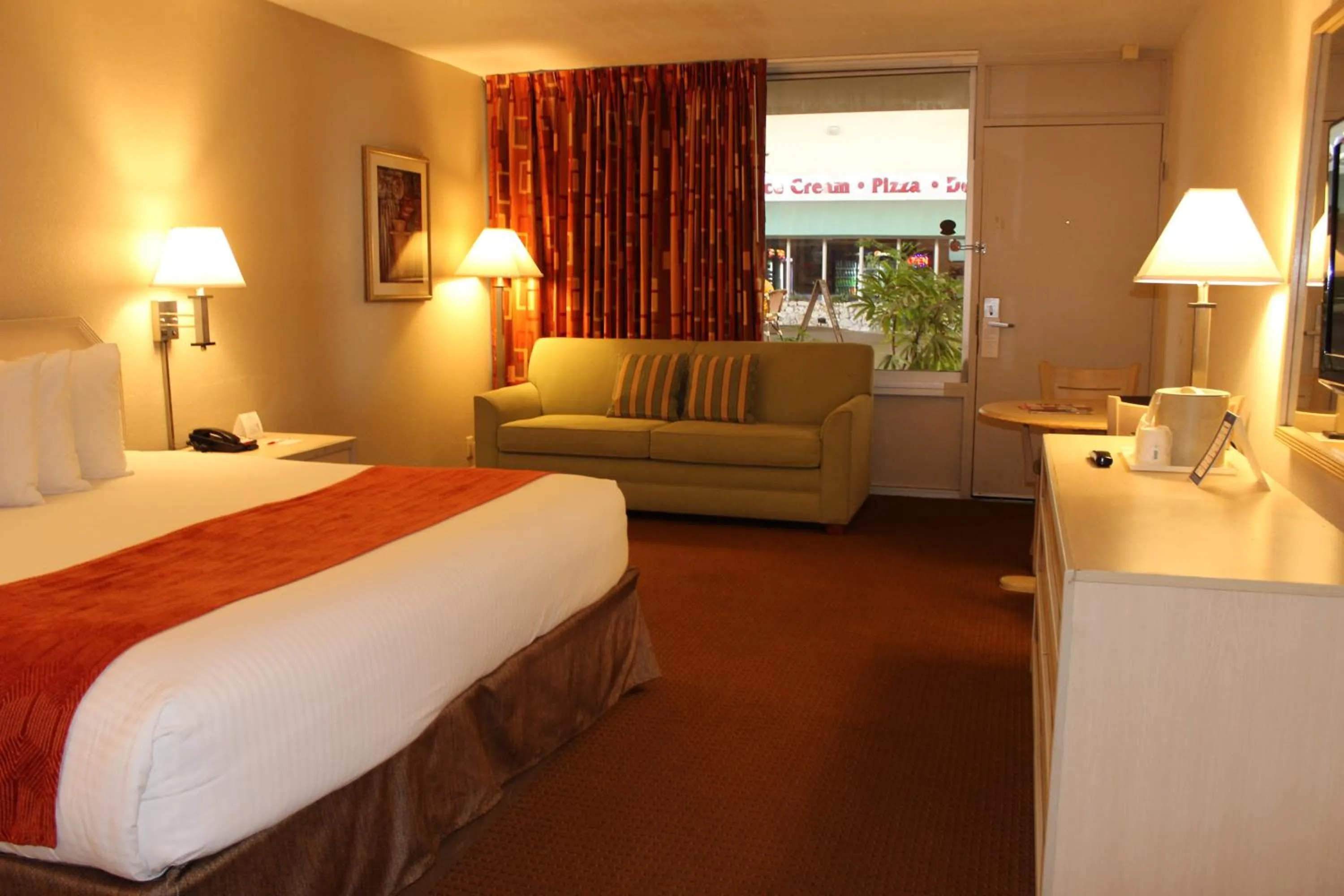 Photo of the whole room, Bed in Ramada by Wyndham Kissimmee Gateway - Free Theme Park Shuttle