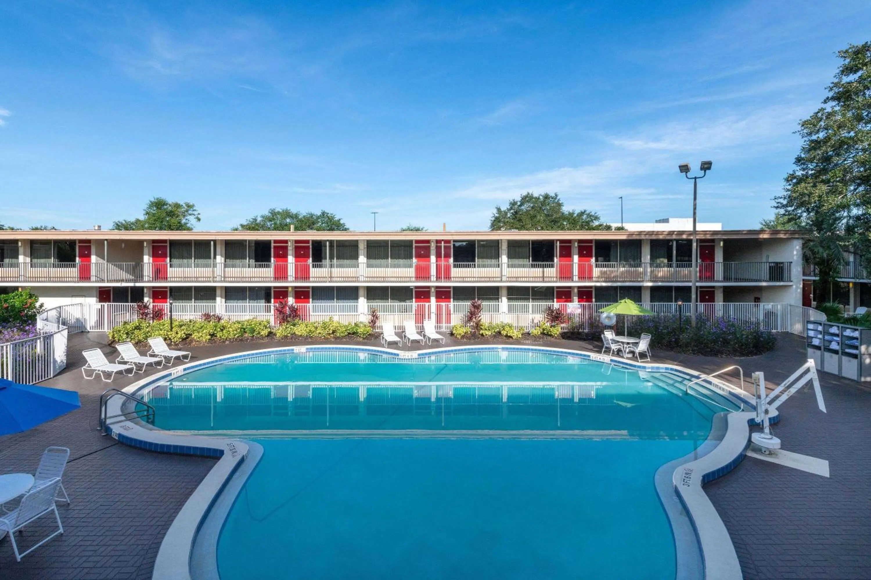 Pool view in Ramada by Wyndham Kissimmee Gateway - Free Theme Park Shuttle