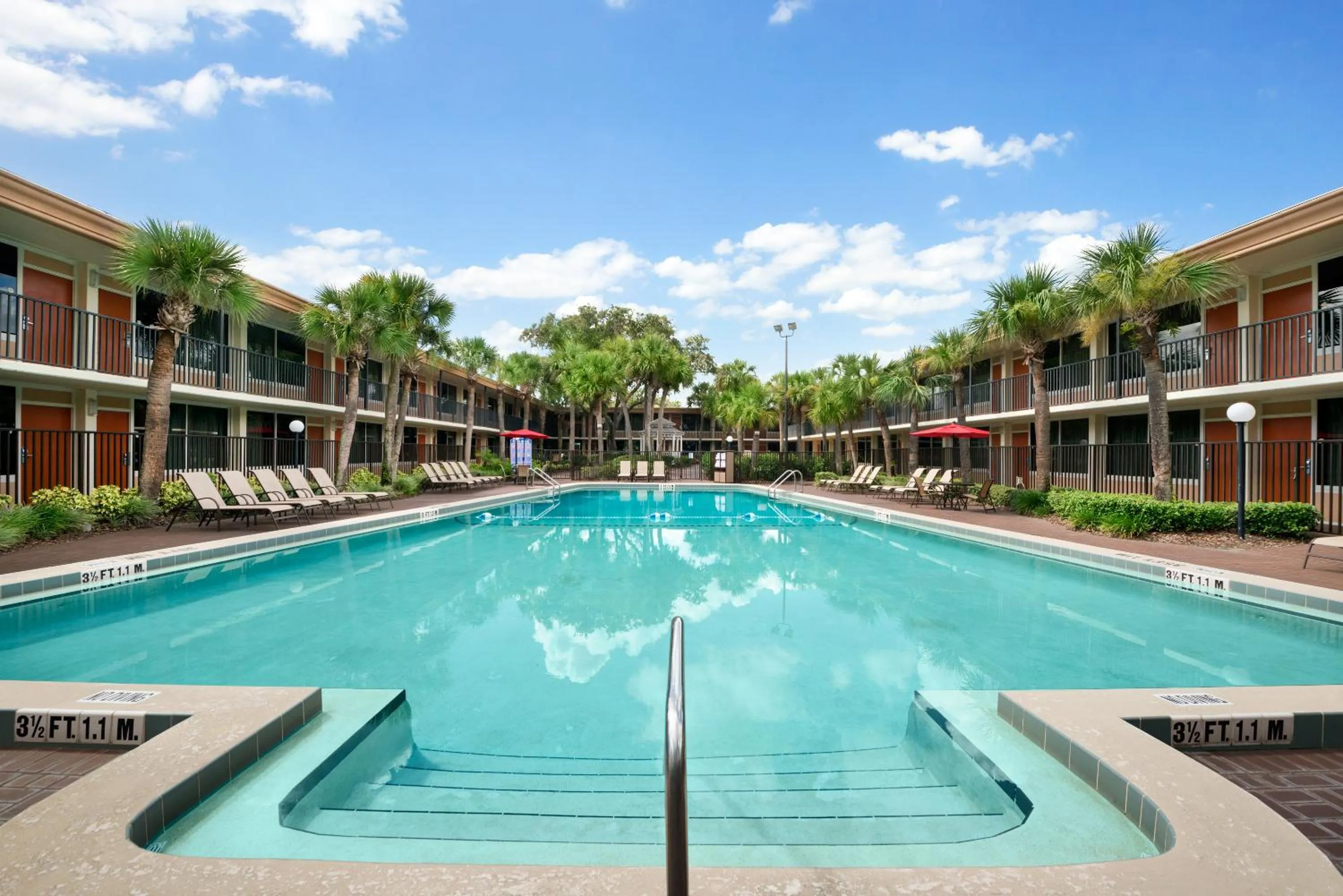 Property building in Ramada by Wyndham Kissimmee Gateway - Free Theme Park Shuttle