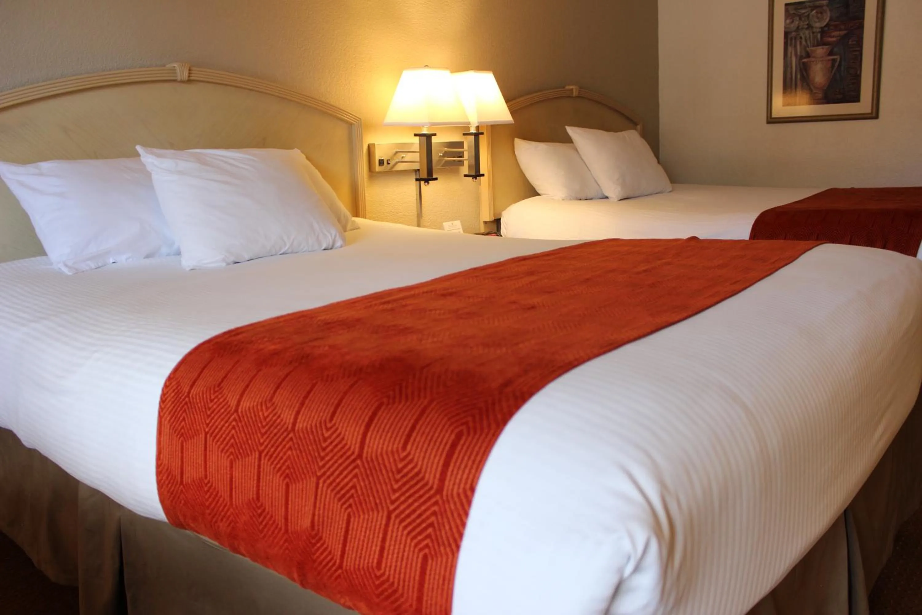 Bed in Ramada by Wyndham Kissimmee Gateway - Free Theme Park Shuttle