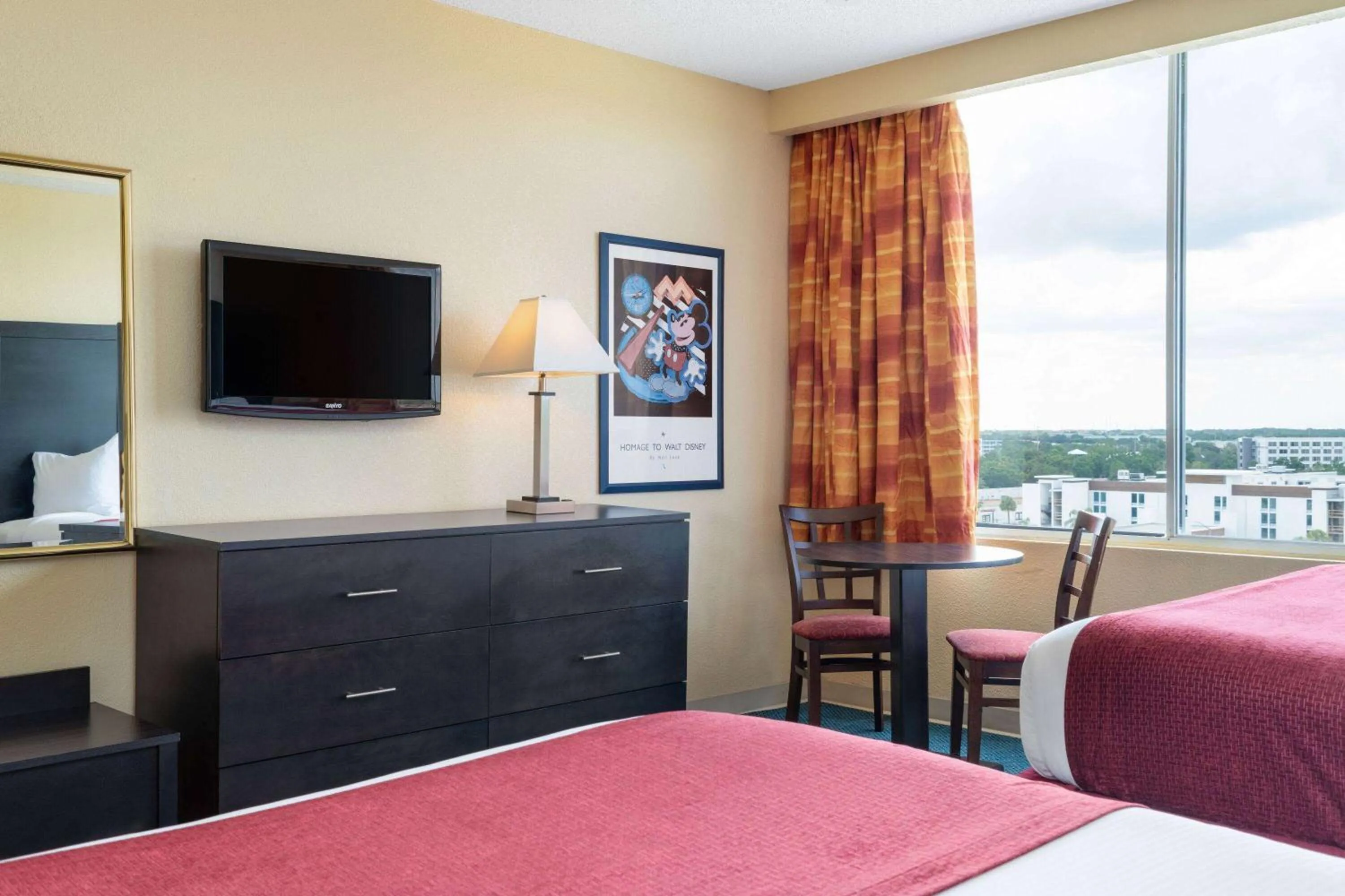Photo of the whole room, Bed in Ramada by Wyndham Kissimmee Gateway - Free Theme Park Shuttle