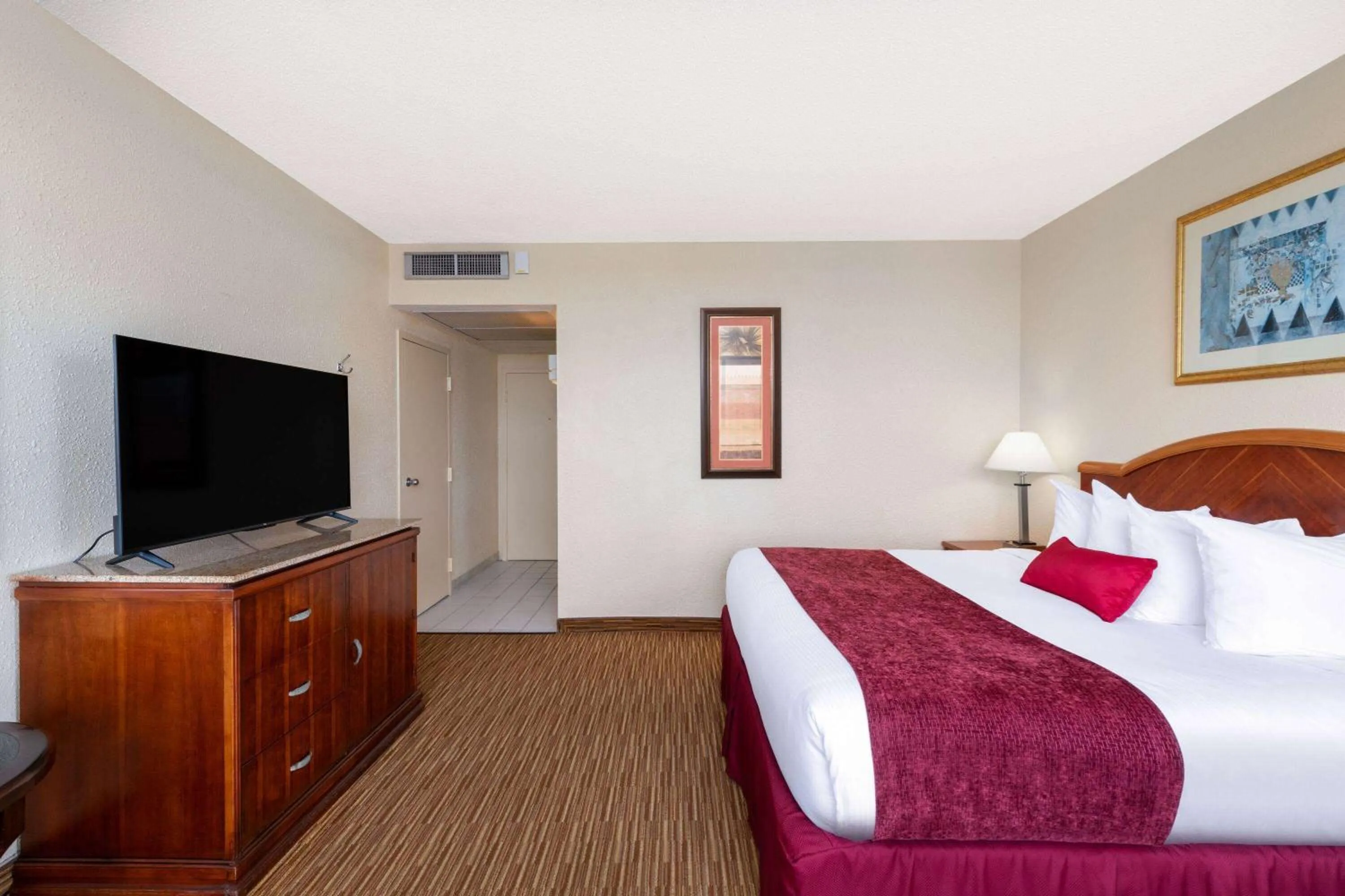 Photo of the whole room, Bed in Ramada by Wyndham Kissimmee Gateway - Free Theme Park Shuttle