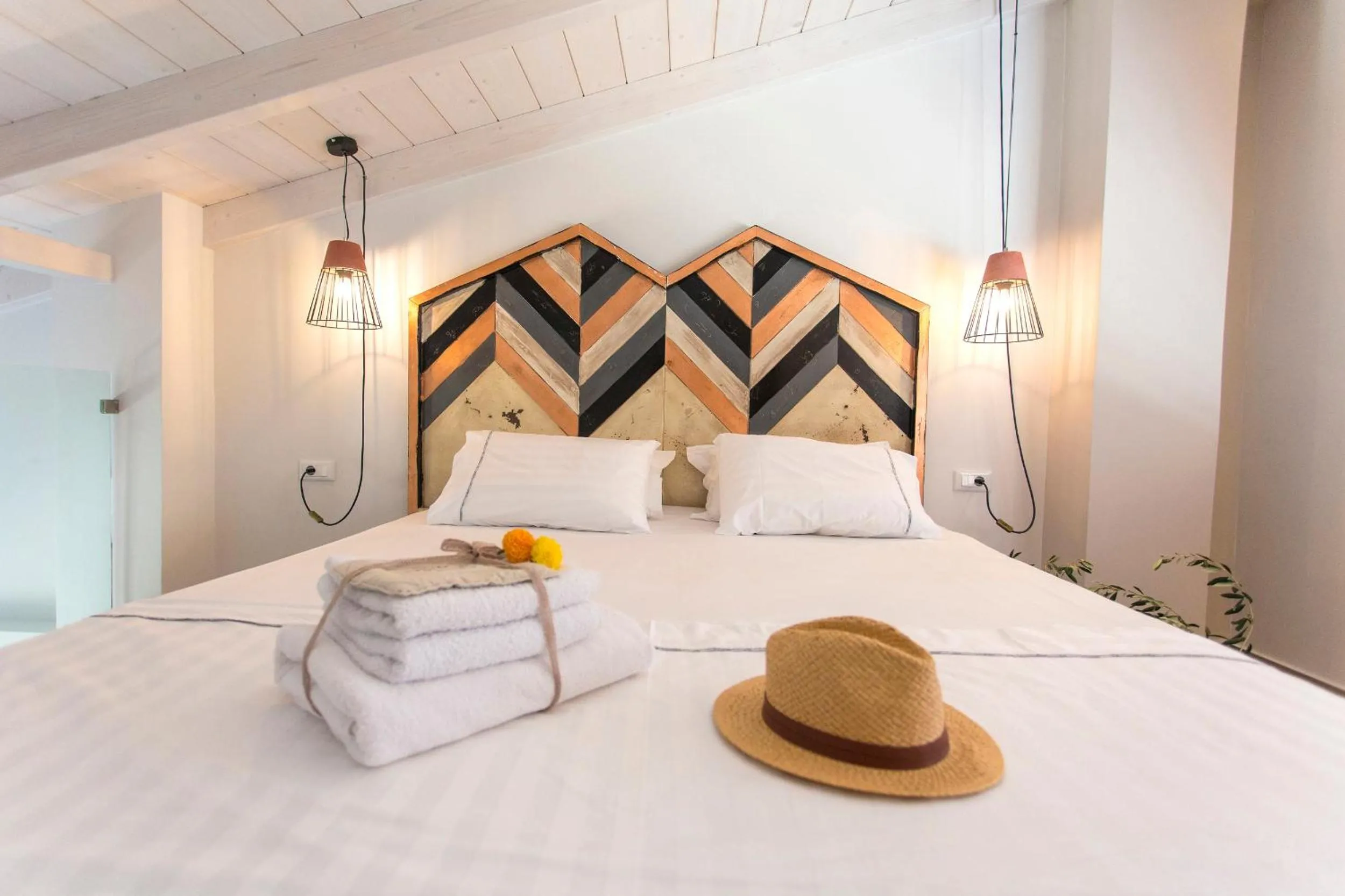 Bed in Golden Bay Suites & Maisonettes