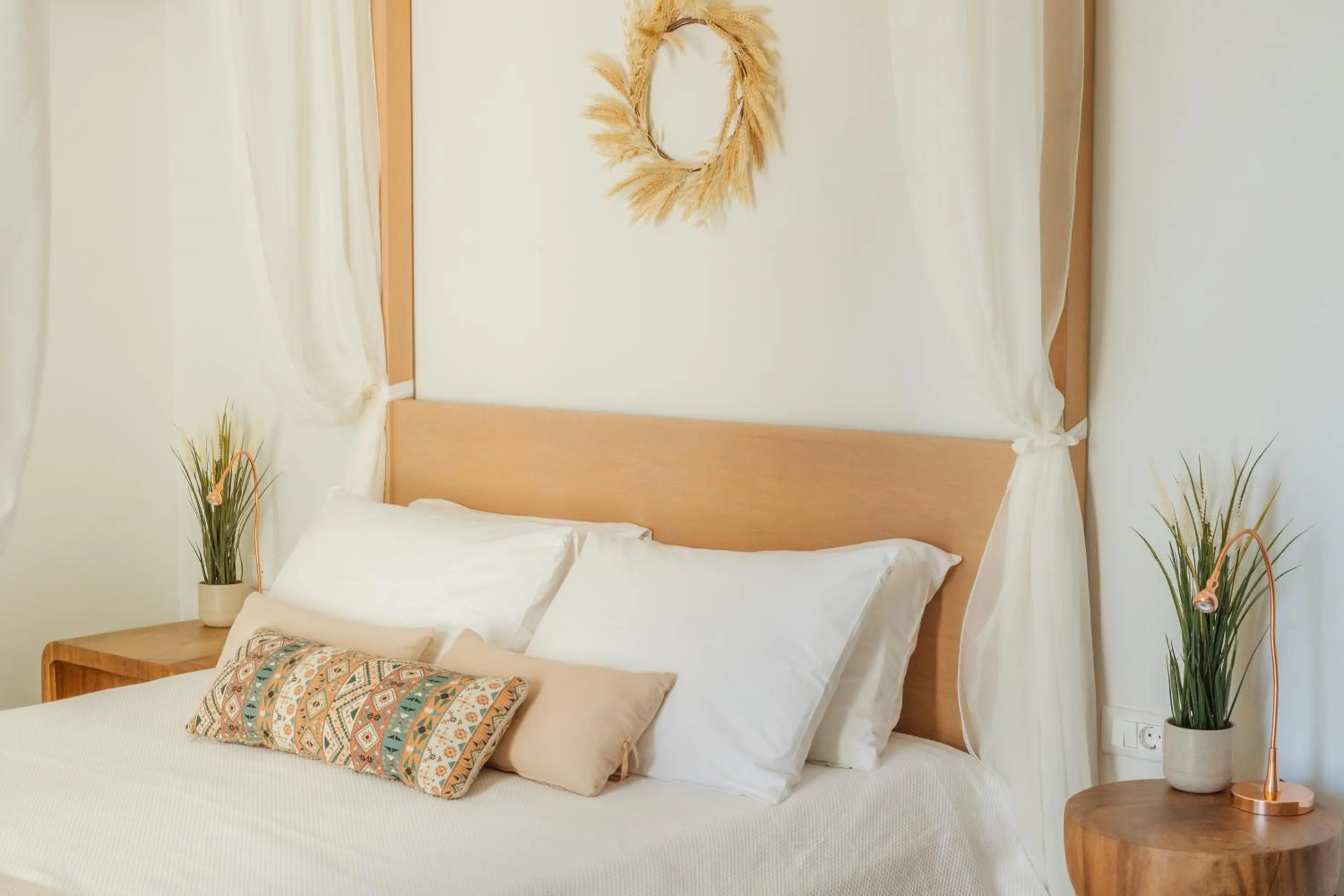 Bed in Golden Bay Suites & Maisonettes