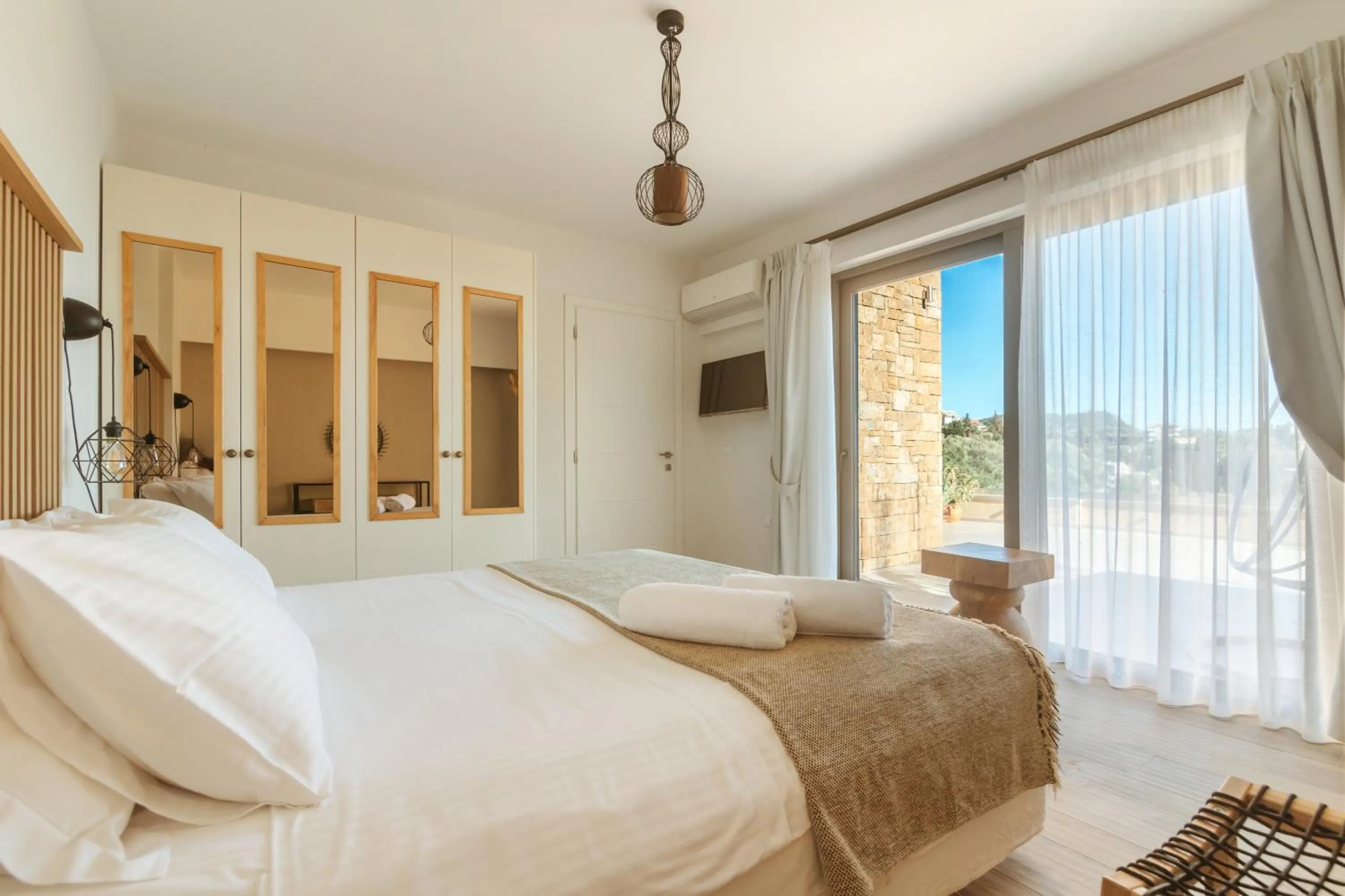 Bed in Golden Bay Suites & Maisonettes