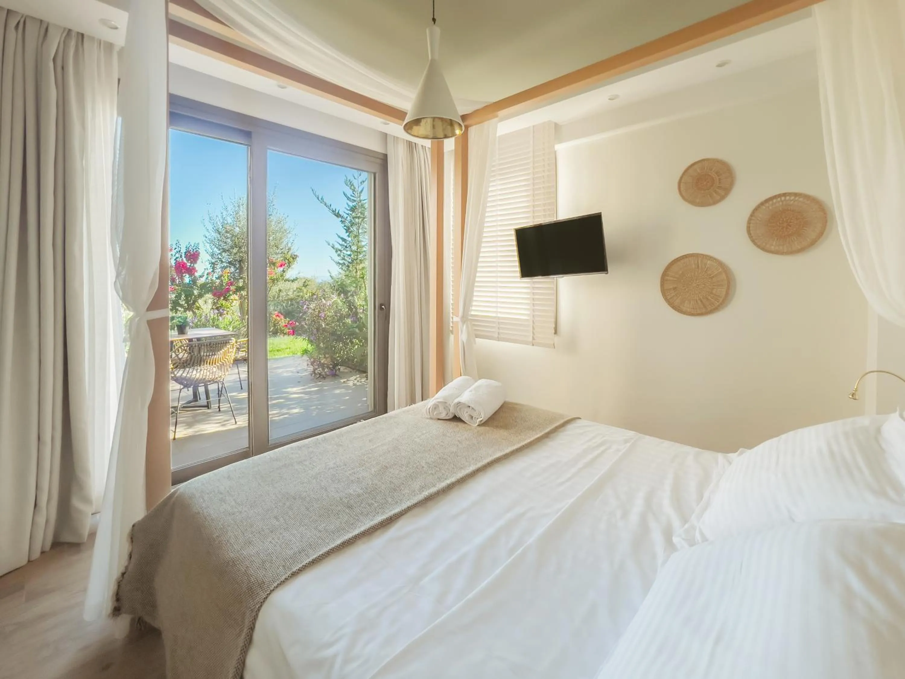 Bed in Golden Bay Suites & Maisonettes